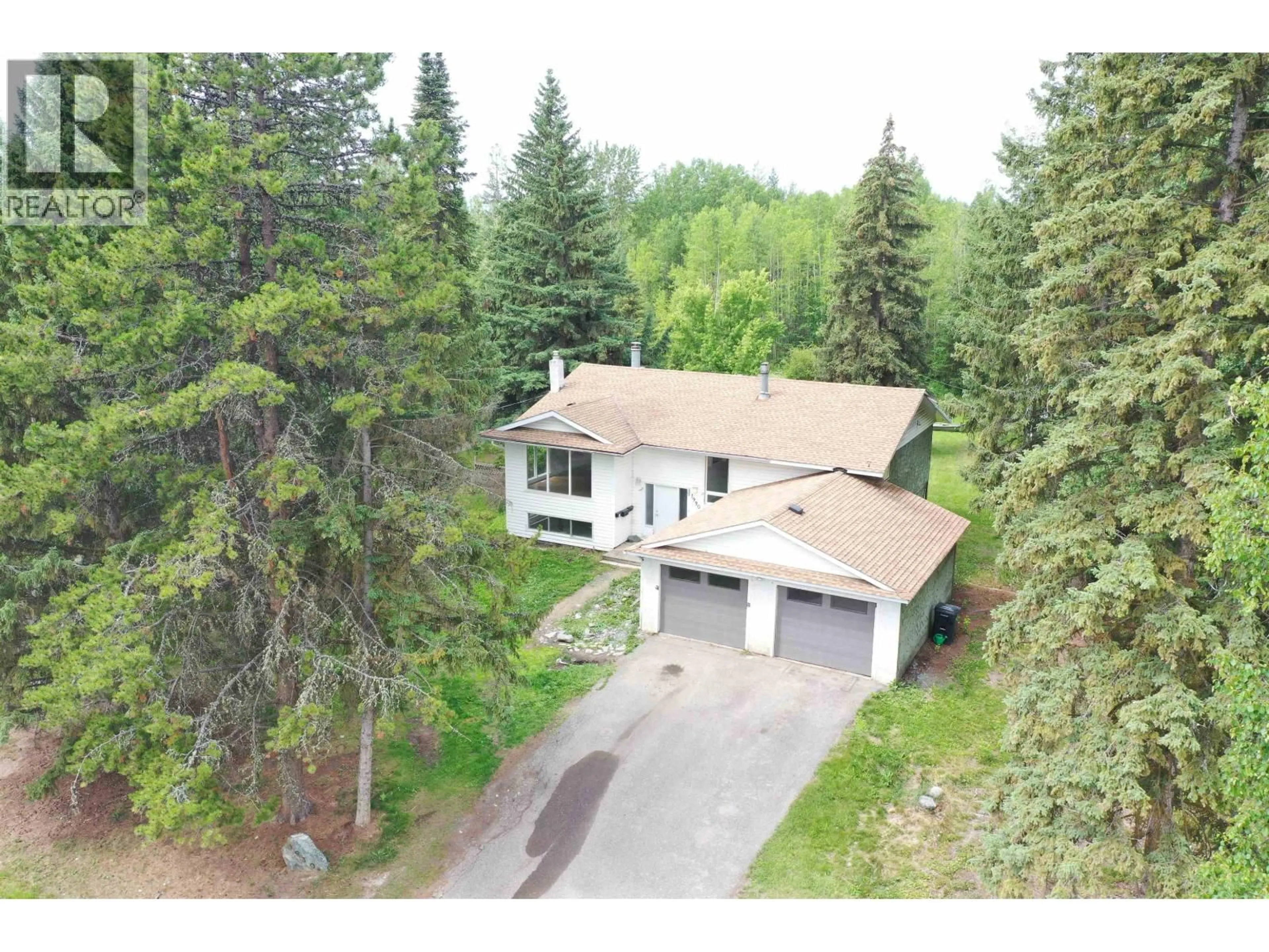 A pic from outside/outdoor area/front of a property/back of a property/a pic from drone, forest/trees view for 1930 BEACH CRESCENT, Quesnel British Columbia V2J4J6