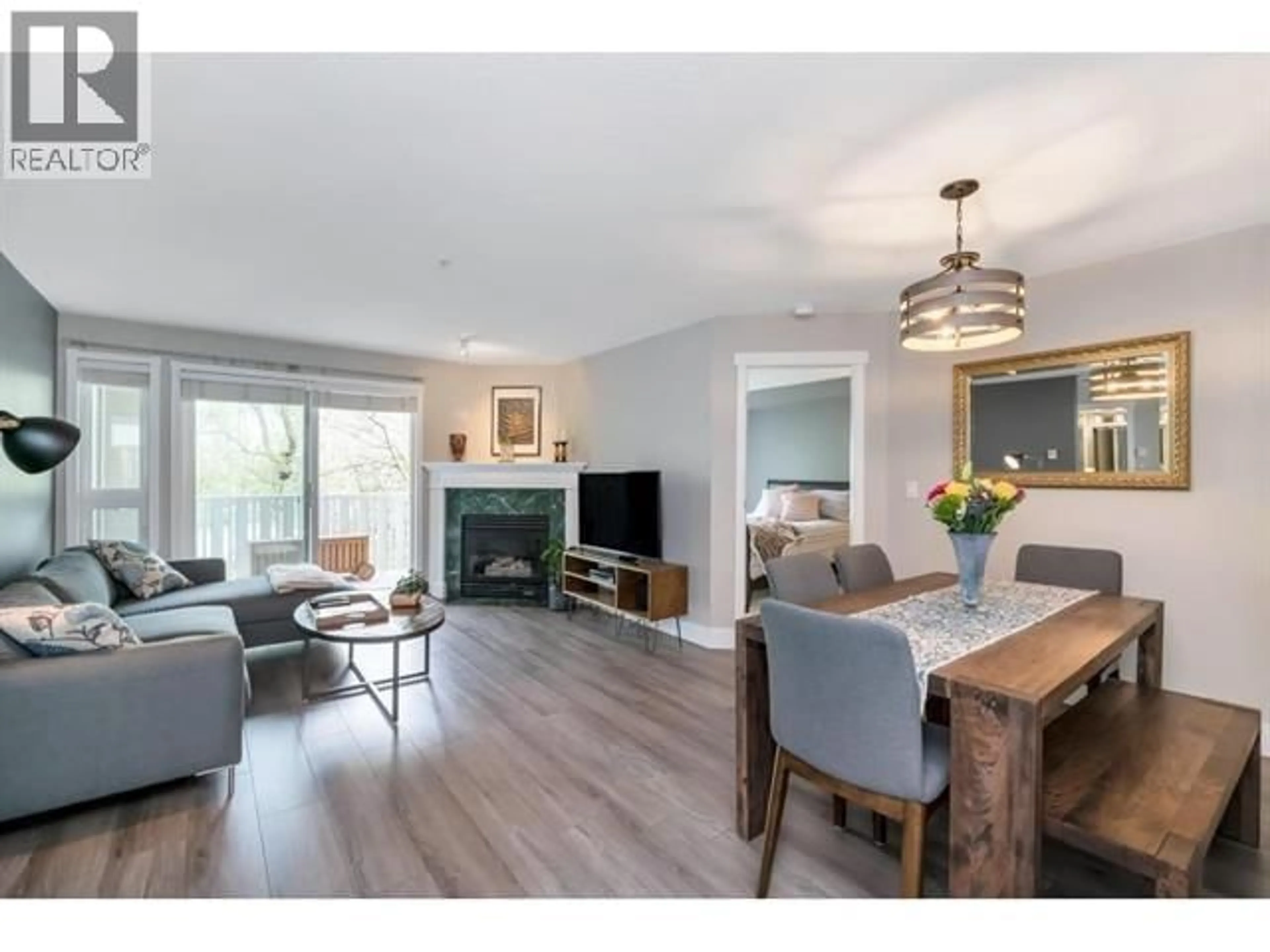Living room with furniture, wood/laminate floor for 209 - 8080 JONES ROAD, Richmond British Columbia V6Y4A9