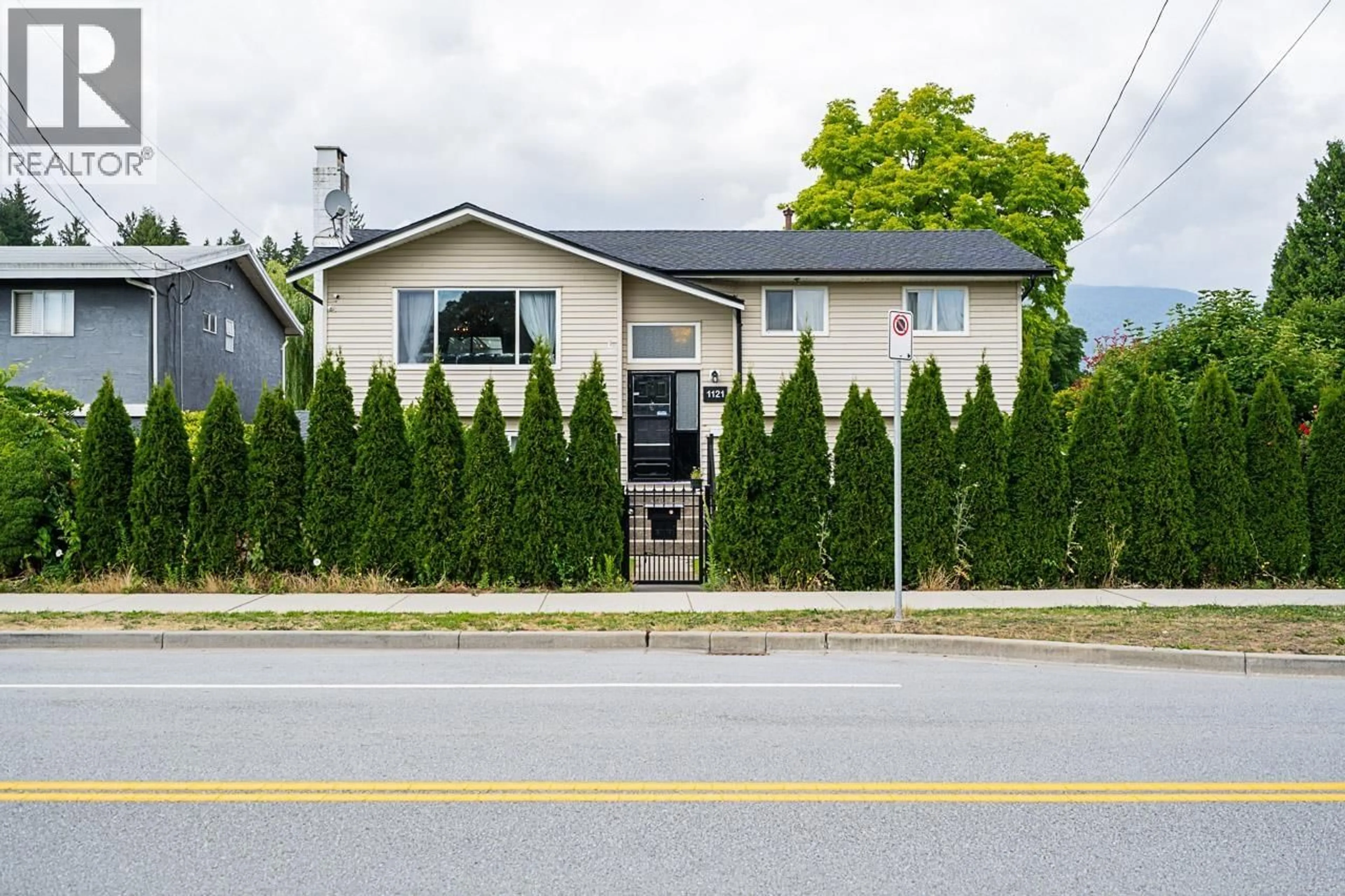 Home with vinyl exterior material, street for 1121 PRAIRIE AVENUE, Port Coquitlam British Columbia V3B1S7