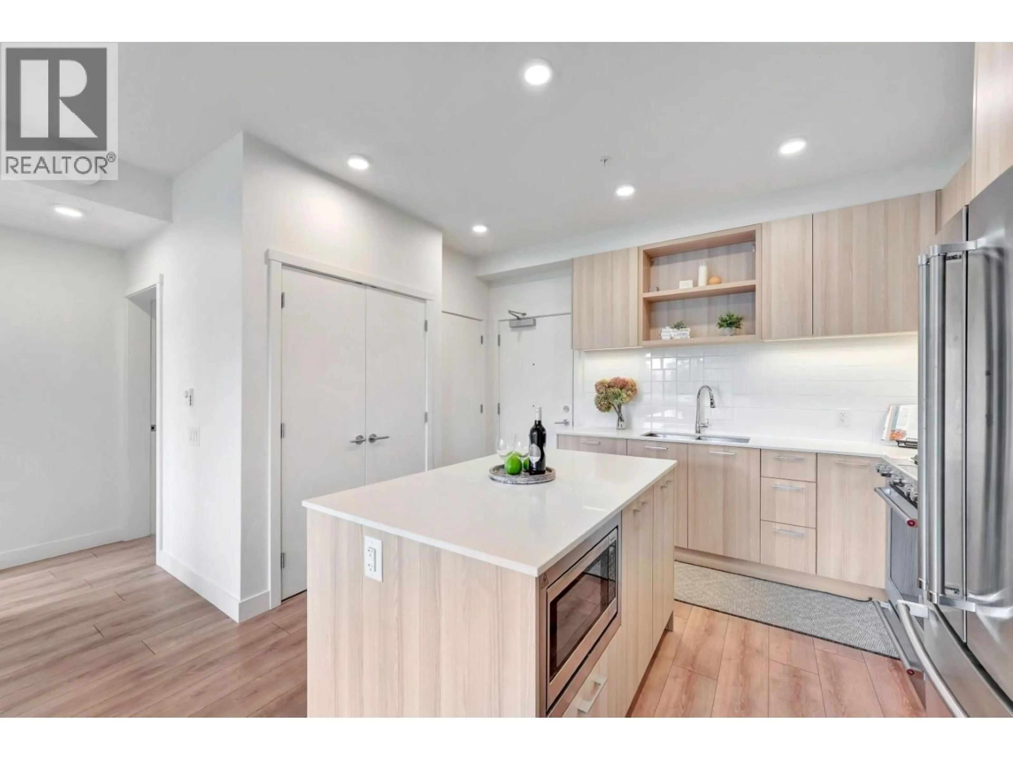 Open concept kitchen, wood/laminate floor for 510 - 741 ANSKAR COURT, Coquitlam British Columbia V3J0N3