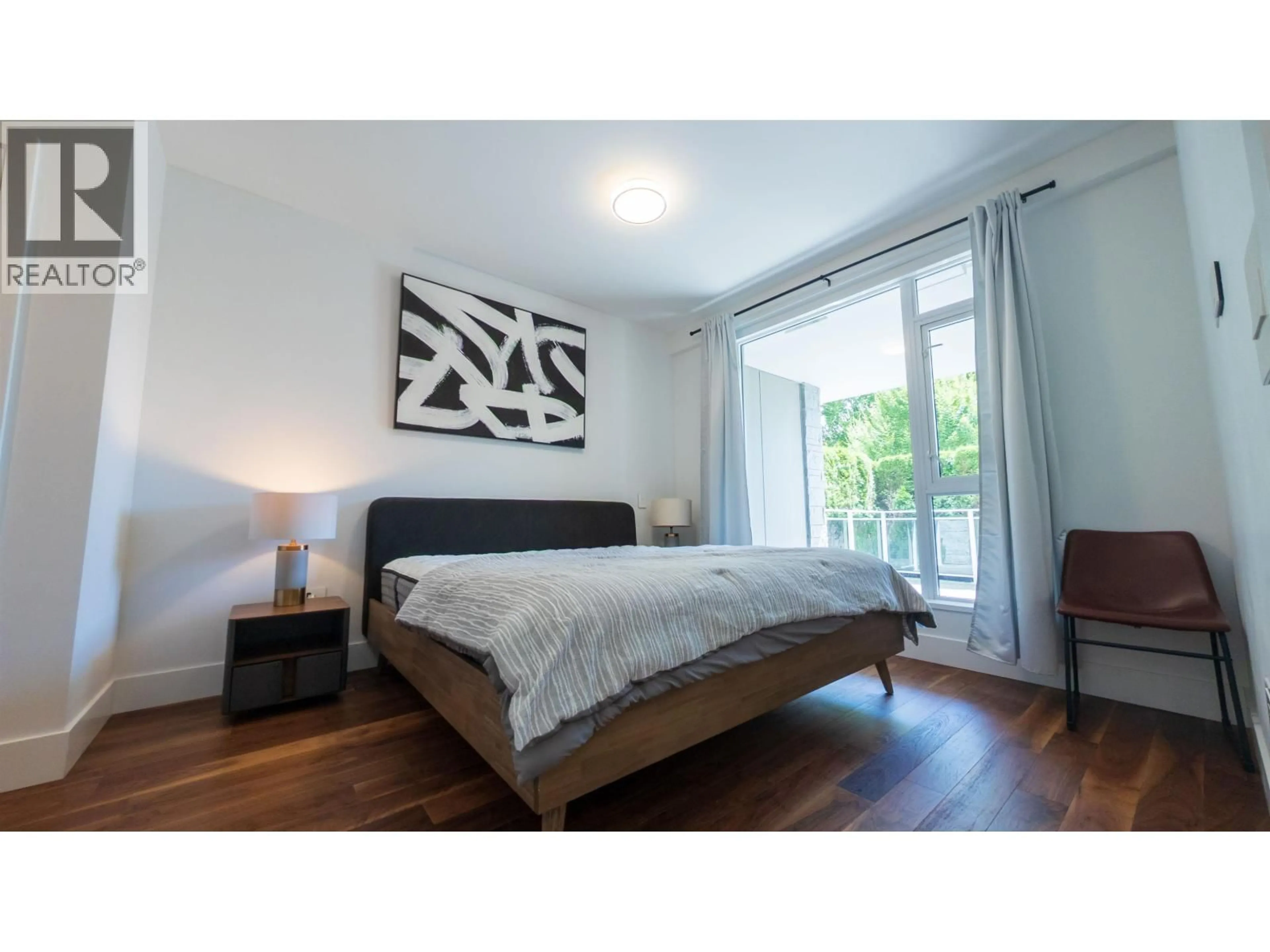 Bedroom with bed, wood/laminate floor for 105 - 375 59TH AVENUE, Vancouver British Columbia V5X0J4