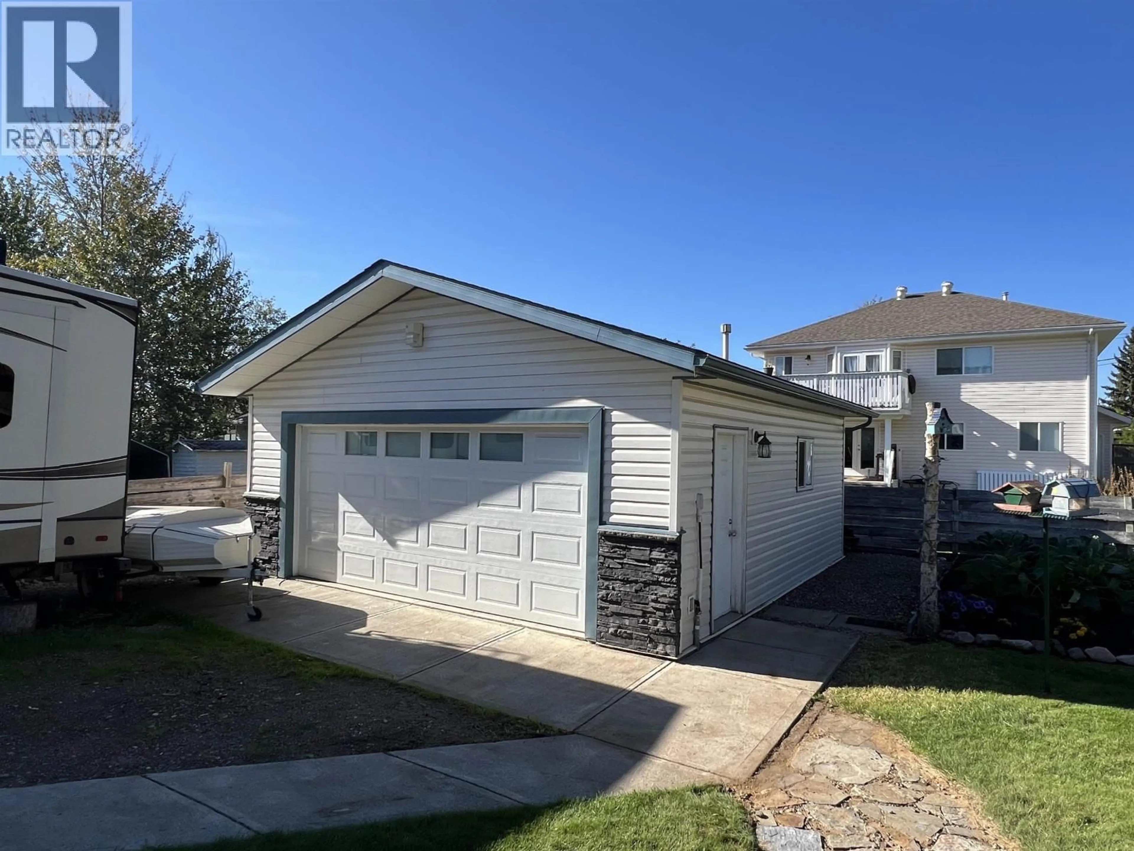 Home with vinyl exterior material, street for 4815 SPRUCE AVENUE, Fort Nelson British Columbia V0C1R0