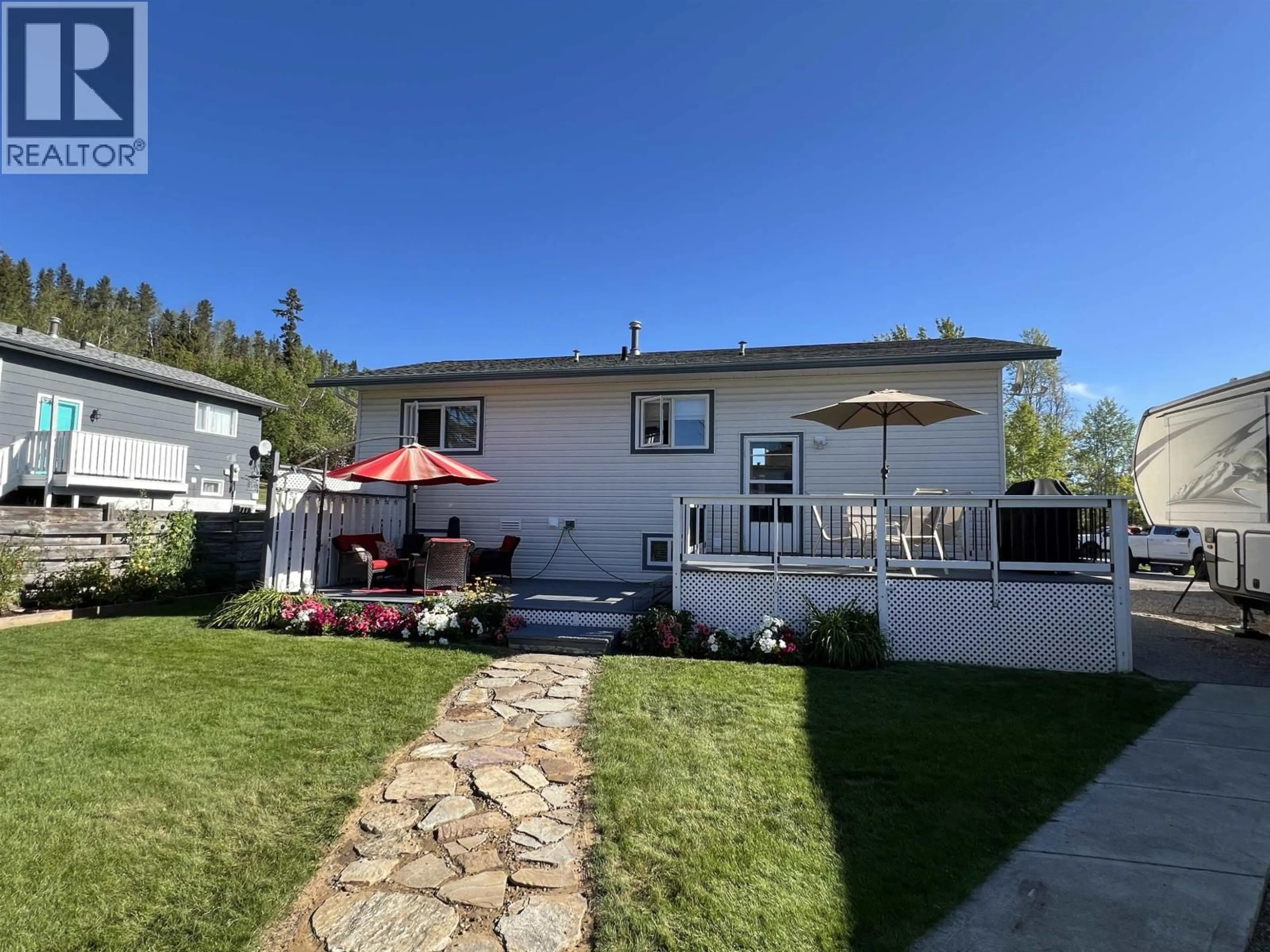 Home with vinyl exterior material, street for 4815 SPRUCE AVENUE, Fort Nelson British Columbia V0C1R0