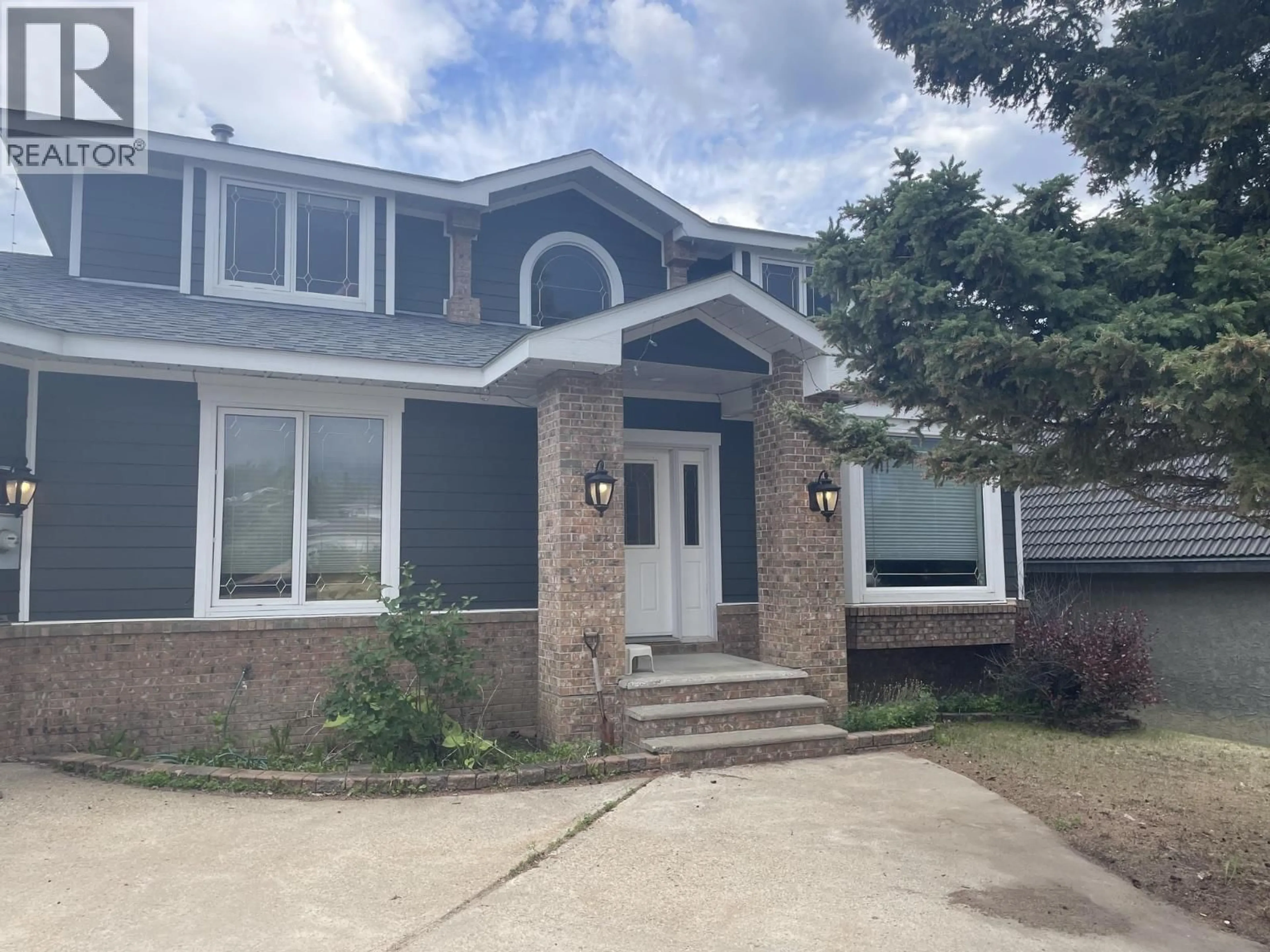 Home with brick exterior material, street for 5524 MINNAKER CRESCENT, Fort Nelson British Columbia V0C1R0