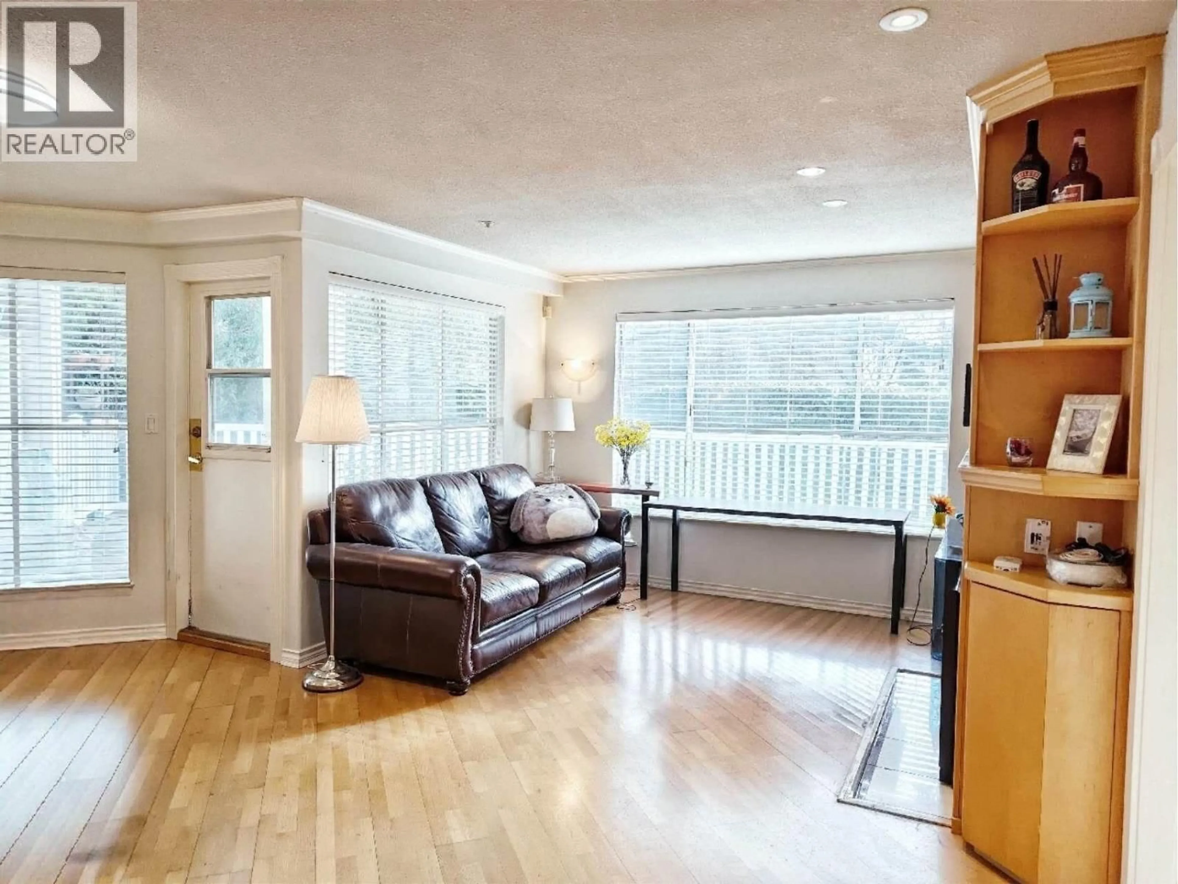 Living room with furniture, wood/laminate floor for 128 - 8880 JONES ROAD, Richmond British Columbia V6Y3Z1