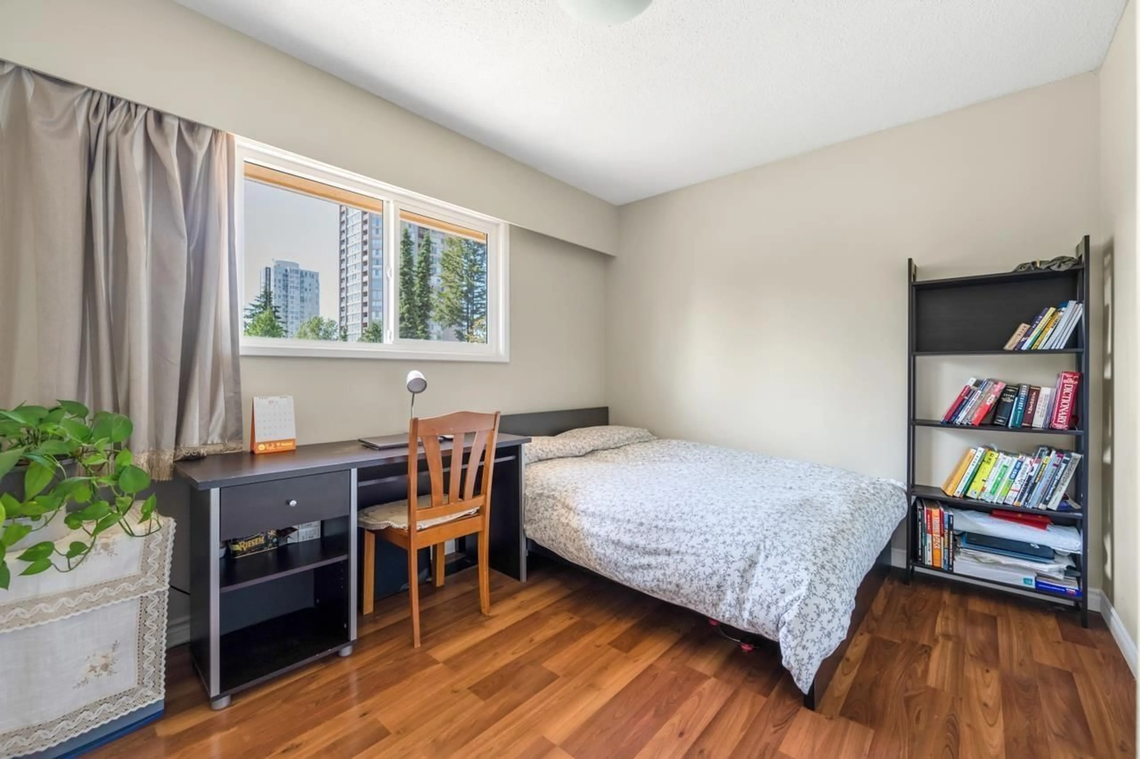 Bedroom with bed, wood/laminate floor for 10355 149A STREET, Surrey British Columbia V3R4A5