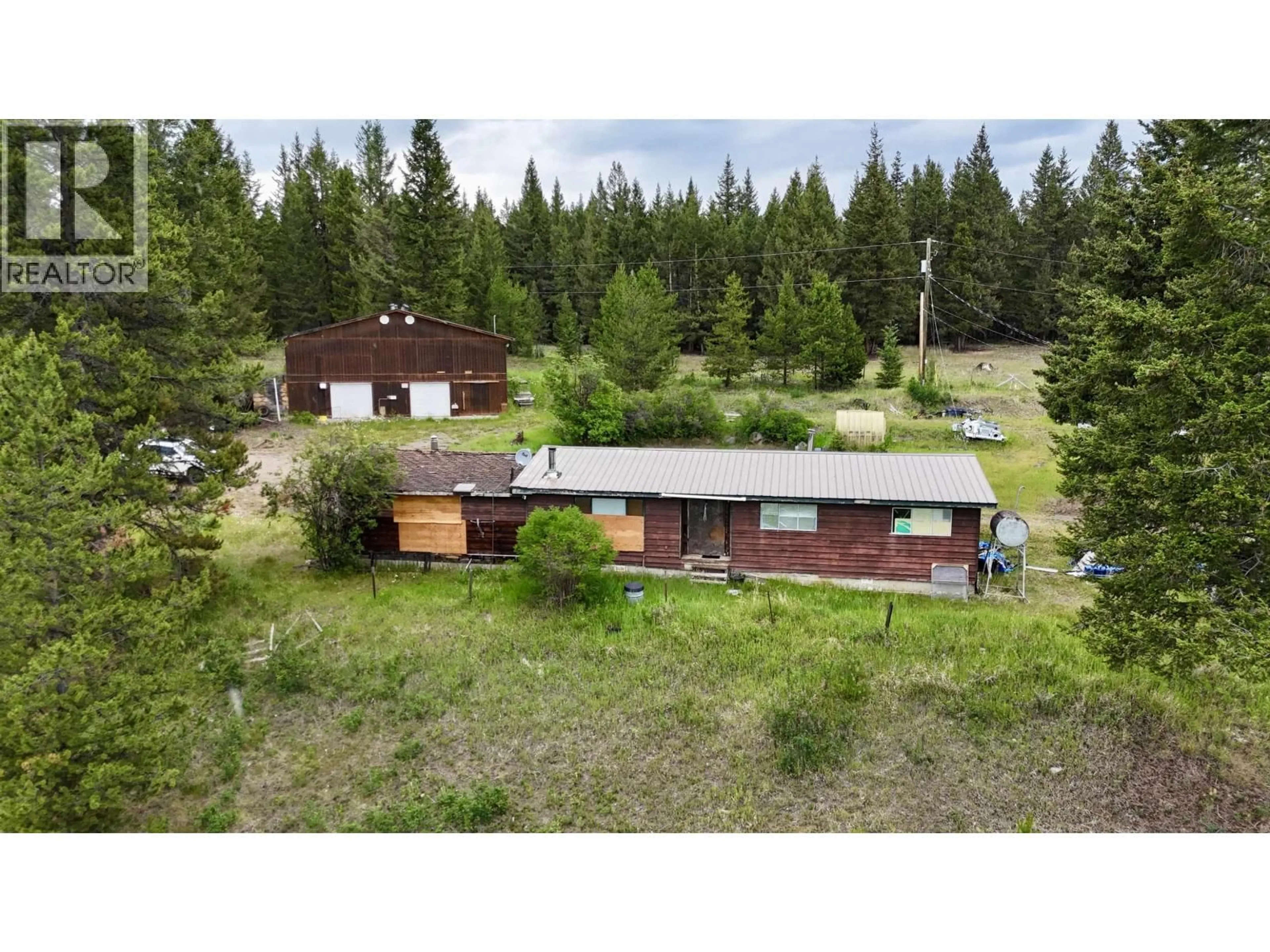 A pic from outside/outdoor area/front of a property/back of a property/a pic from drone, forest/trees view for 5317 HELENA LAKE ROAD, 100 Mile House British Columbia V0K2E1