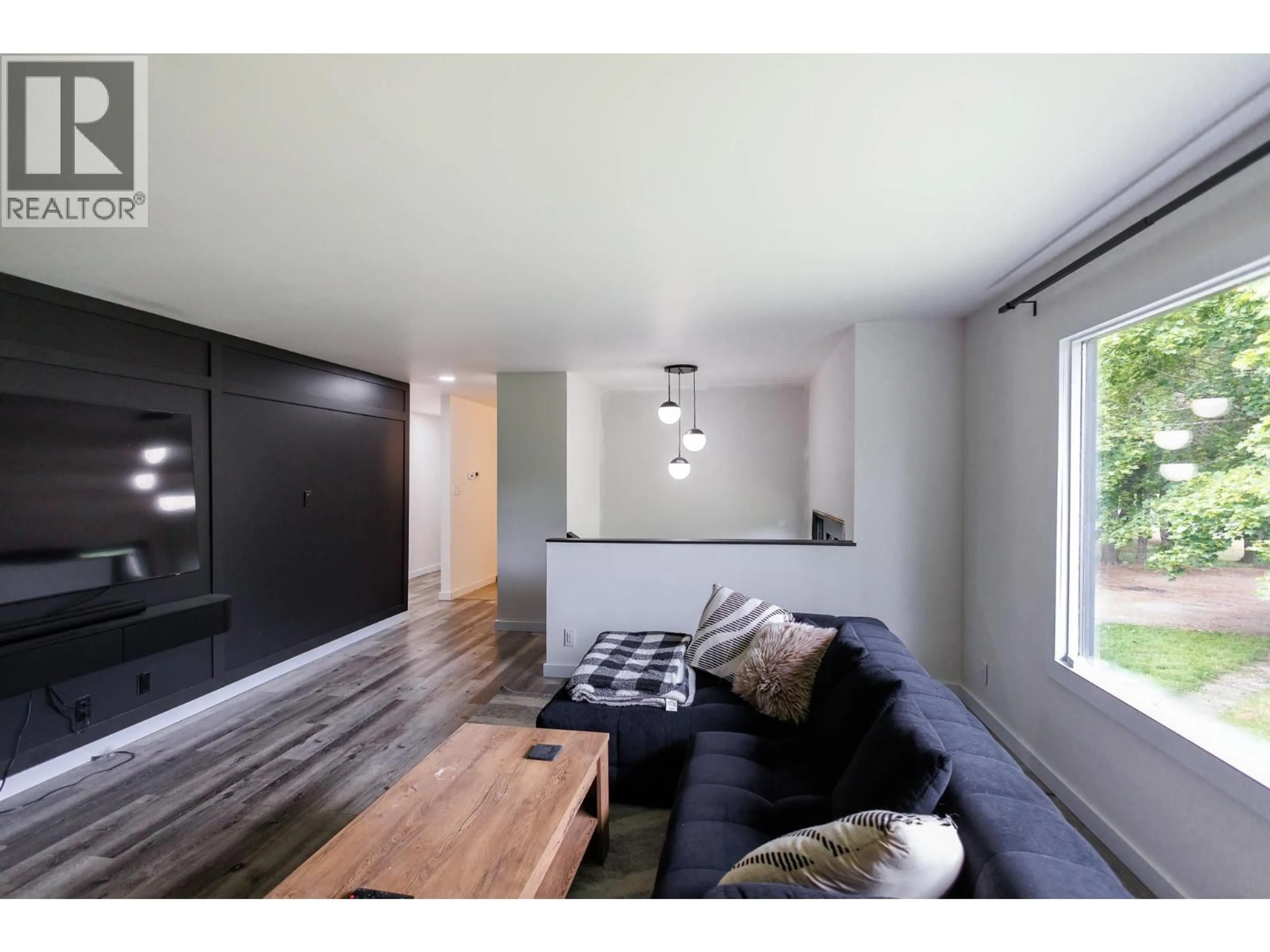 Living room with furniture, wood/laminate floor for 3292 KOFOED DRIVE, Thornhill British Columbia V8G3P7