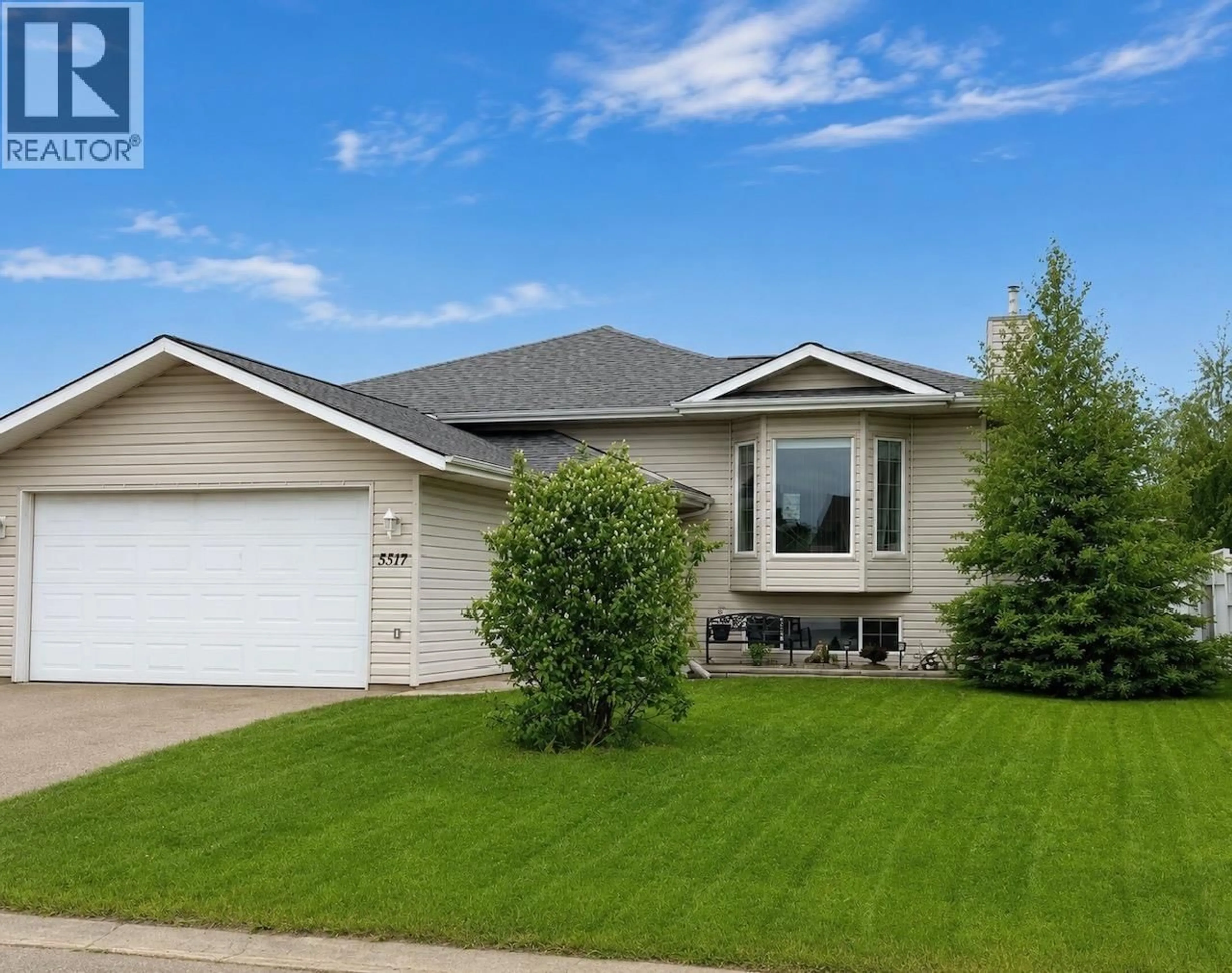 Home with vinyl exterior material, street for 5517 57 AVENUE, Fort Nelson British Columbia V0C1R0