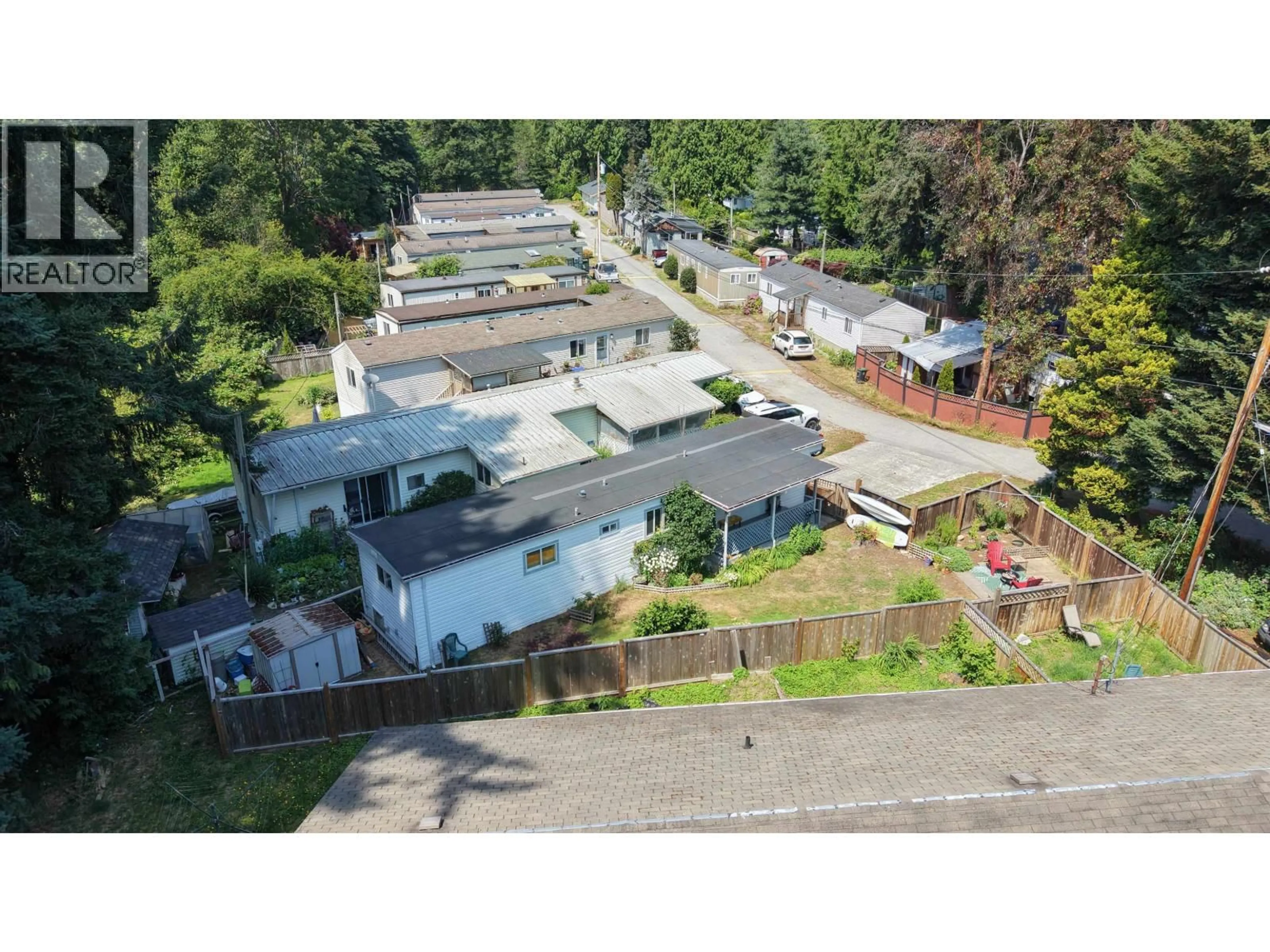 A pic from outside/outdoor area/front of a property/back of a property/a pic from drone, street for 1 - 4514 SUNSHINE COAST HIGHWAY, Sechelt British Columbia V7Z0G9