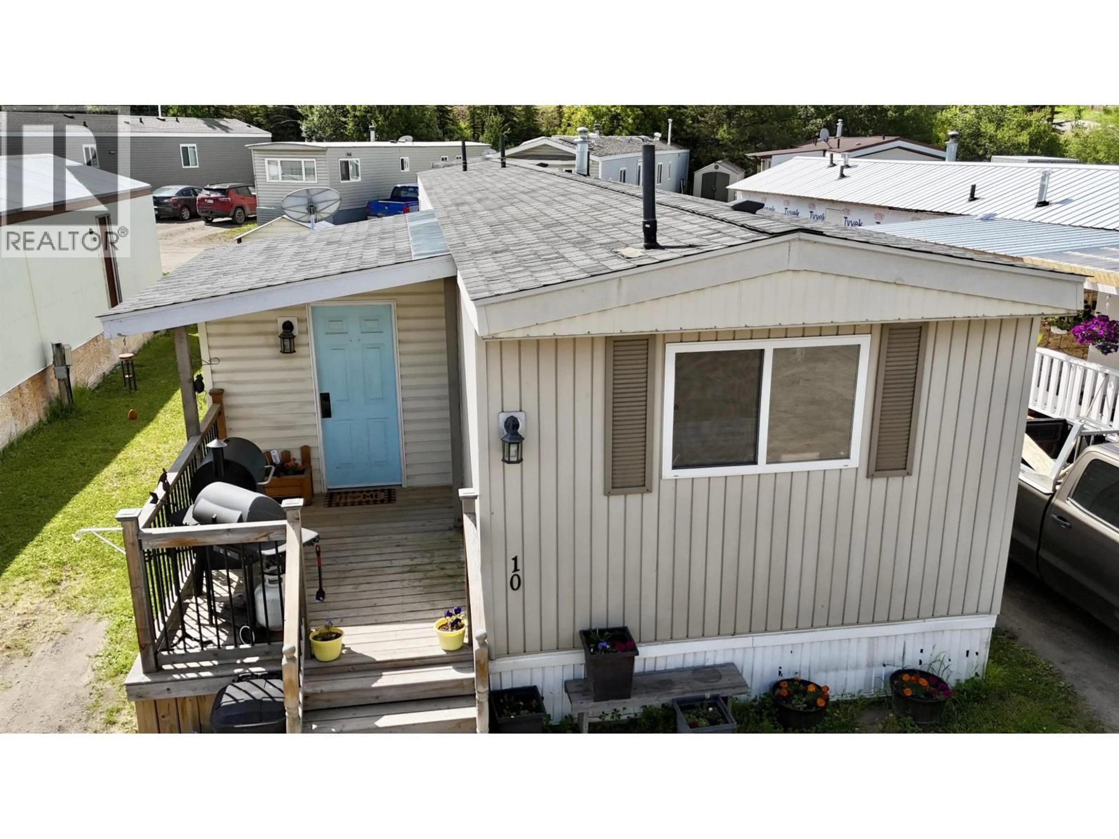A pic from outside/outdoor area/front of a property/back of a property/a pic from drone, street for 10 - 2091 16 HIGHWAY, Vanderhoof British Columbia V0J3A0