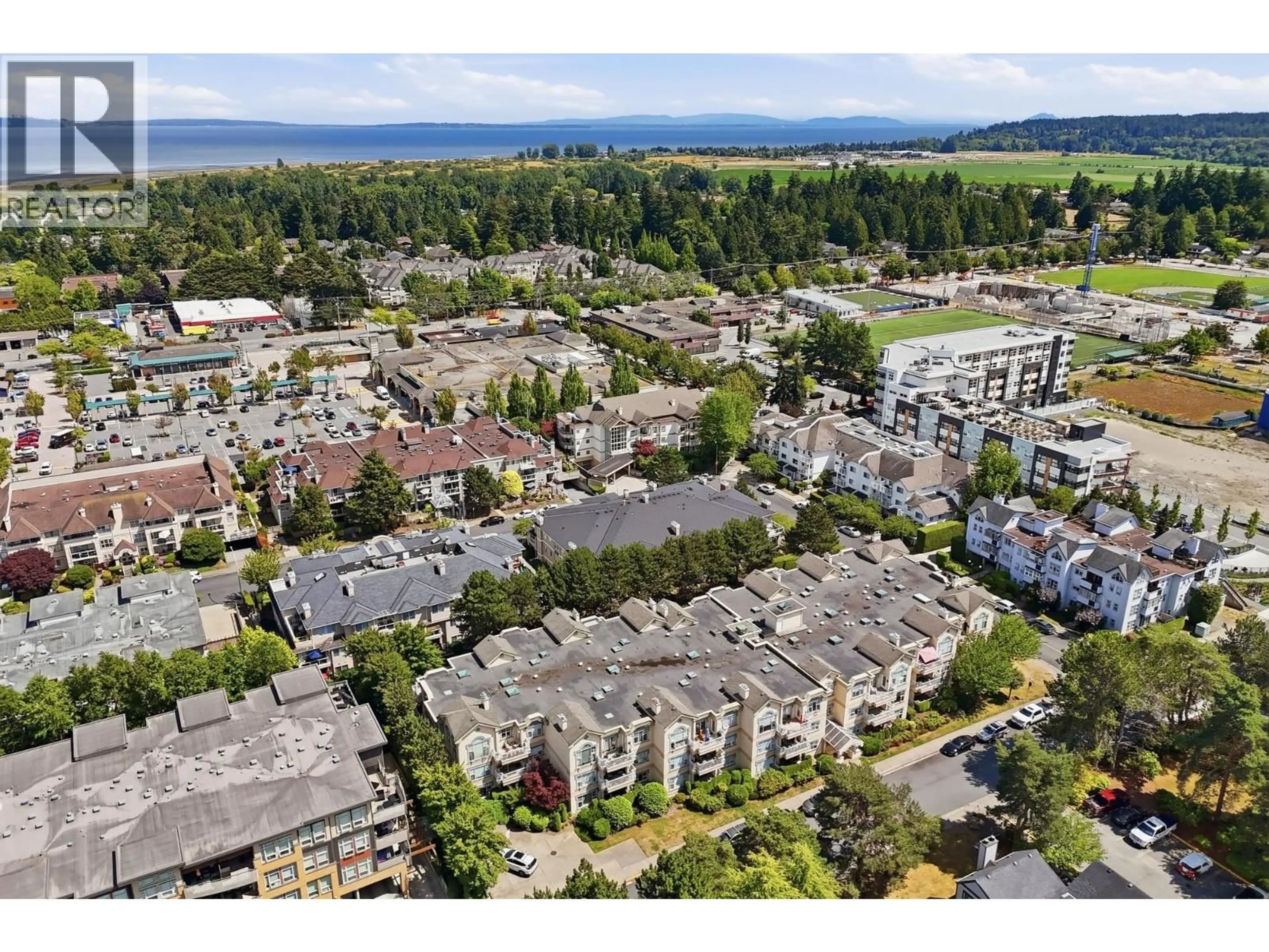 A pic from outside/outdoor area/front of a property/back of a property/a pic from drone, mountain view for 201 - 1150 54A STREET, Delta British Columbia V4M4B5