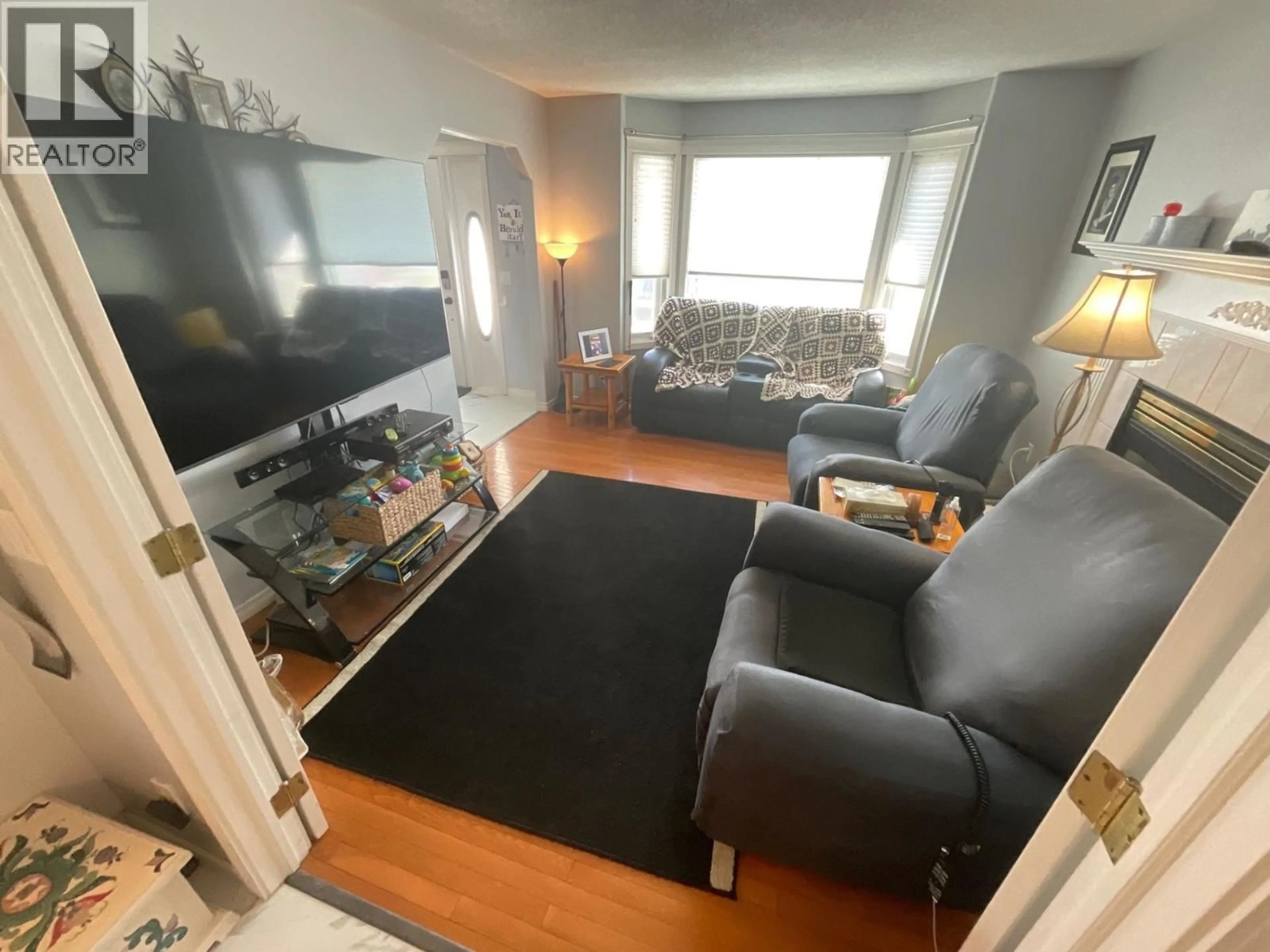 Living room with furniture, unknown for 8144 98 AVENUE, Fort St. John British Columbia V1J1P3