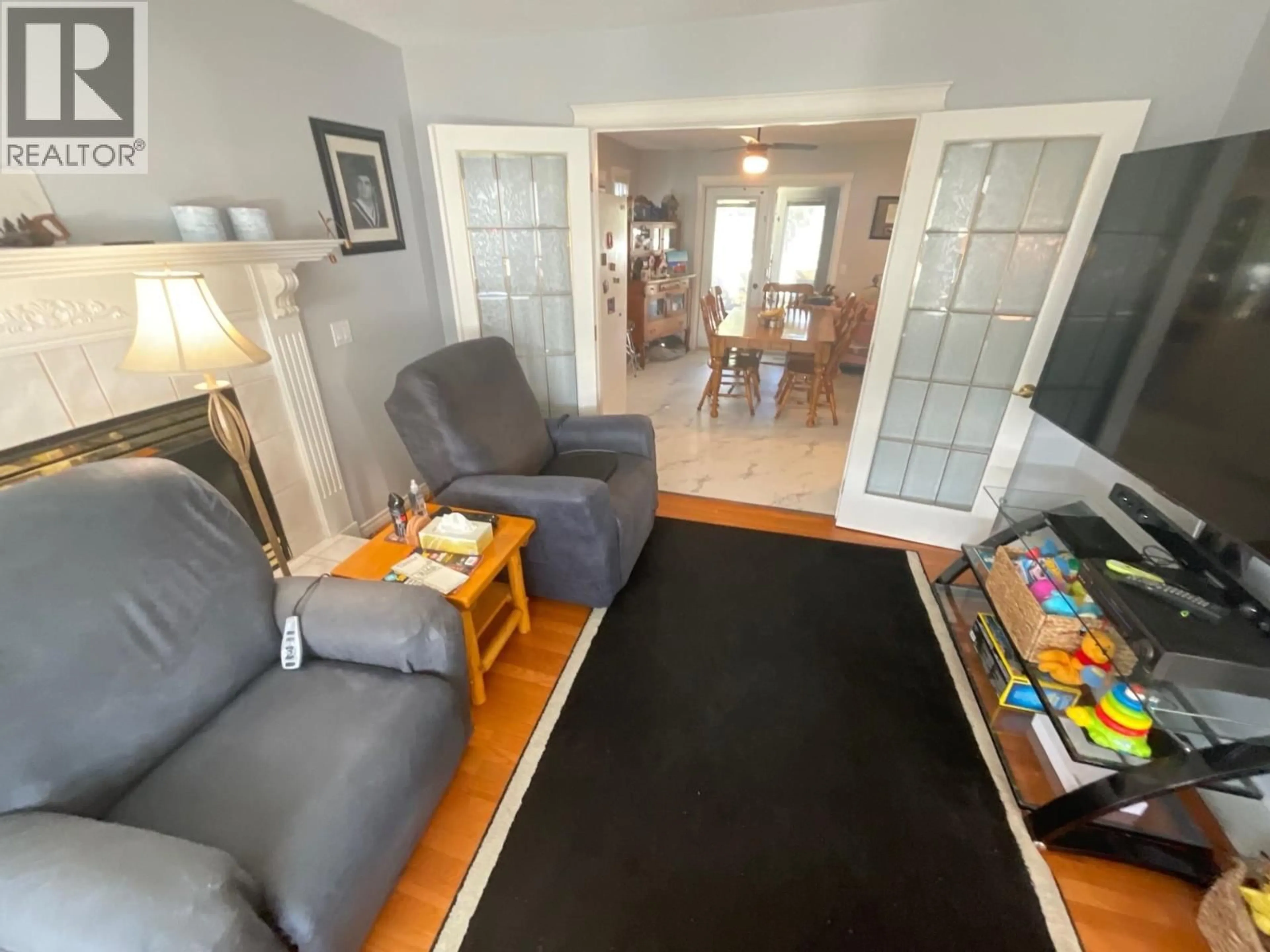 Living room with furniture, unknown for 8144 98 AVENUE, Fort St. John British Columbia V1J1P3