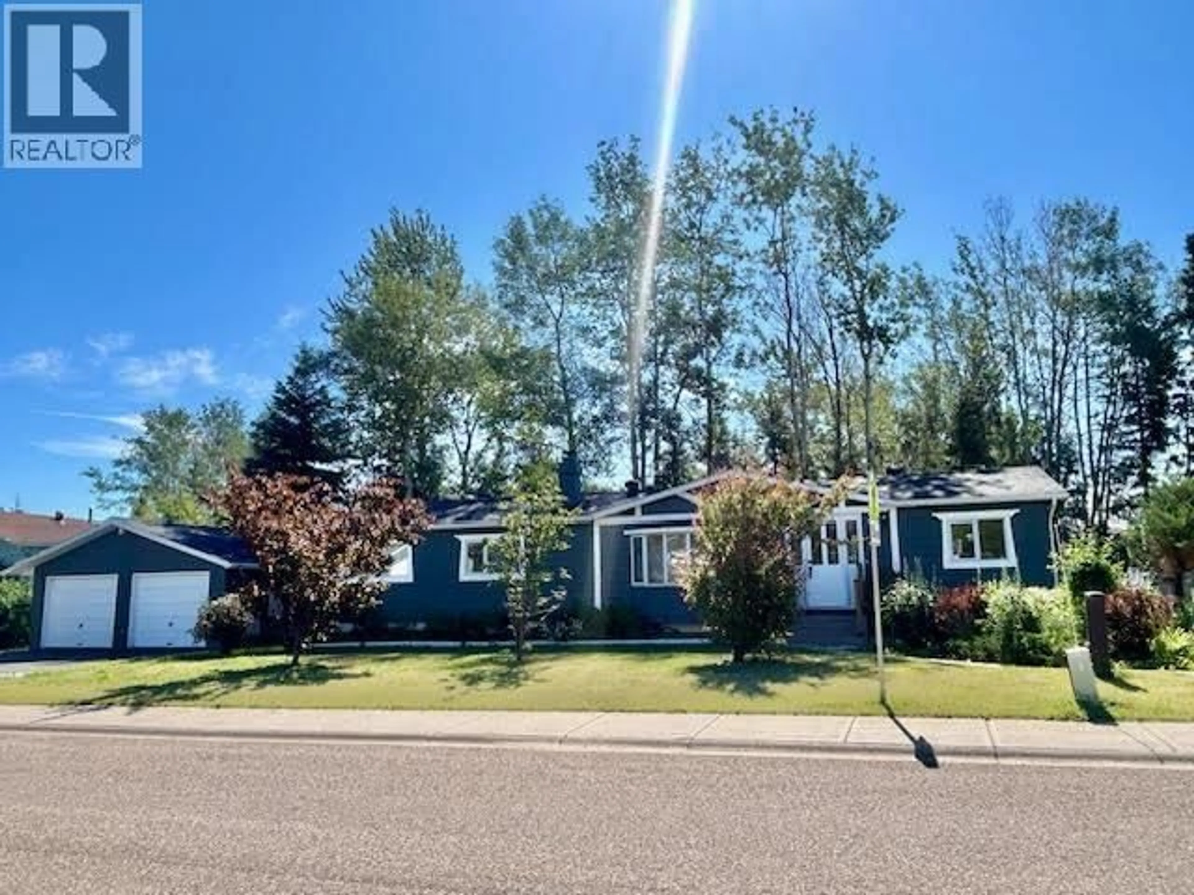 Home with vinyl exterior material, street for 5544 53 STREET, Fort Nelson British Columbia V0C1R0