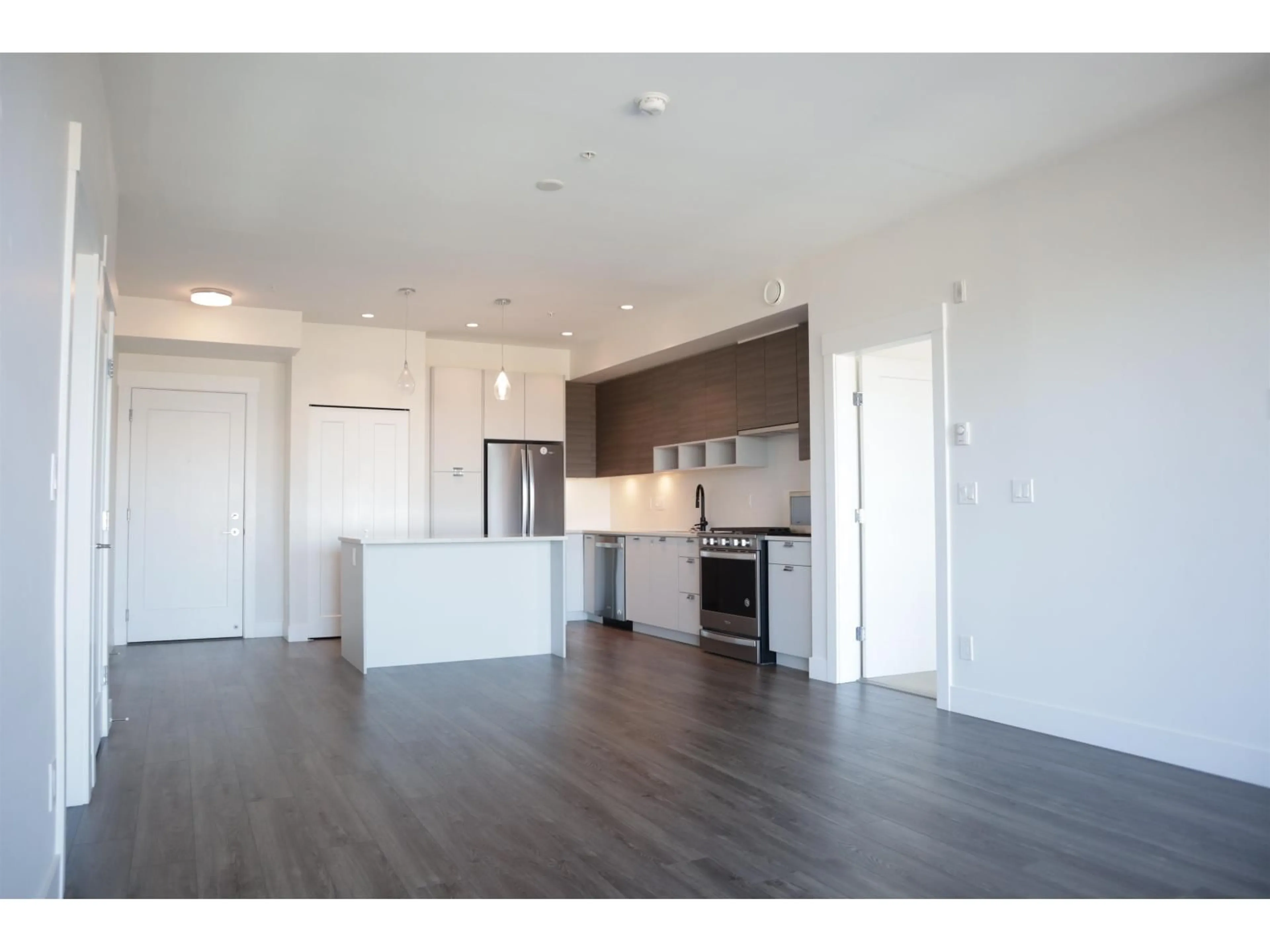 Open concept kitchen, wood/laminate floor for A327 - 20727 WILLOUGHBY TOWN CENTRE DRIVE, Langley British Columbia V2Y3N1