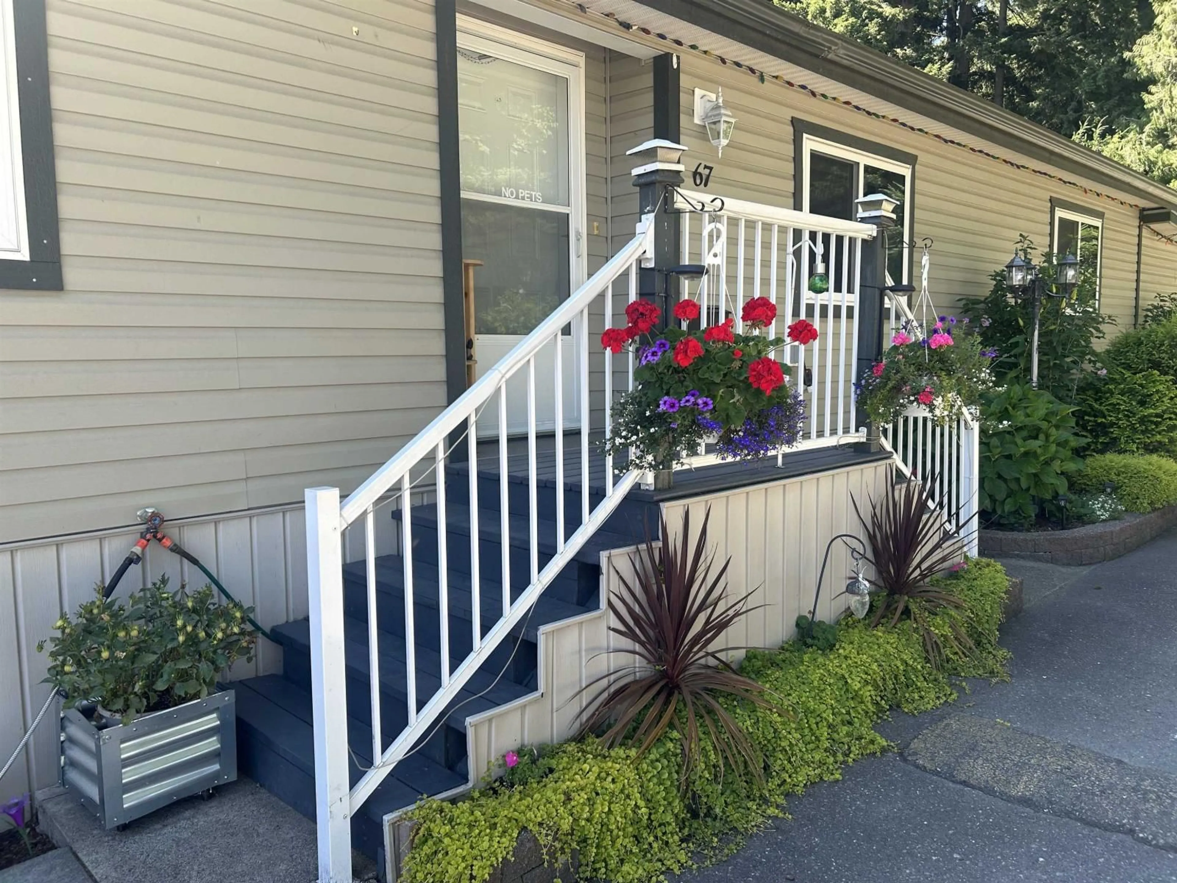 Home with vinyl exterior material, street for 67 - 5742 UNSWORTH ROAD, Chilliwack British Columbia V2R3A2