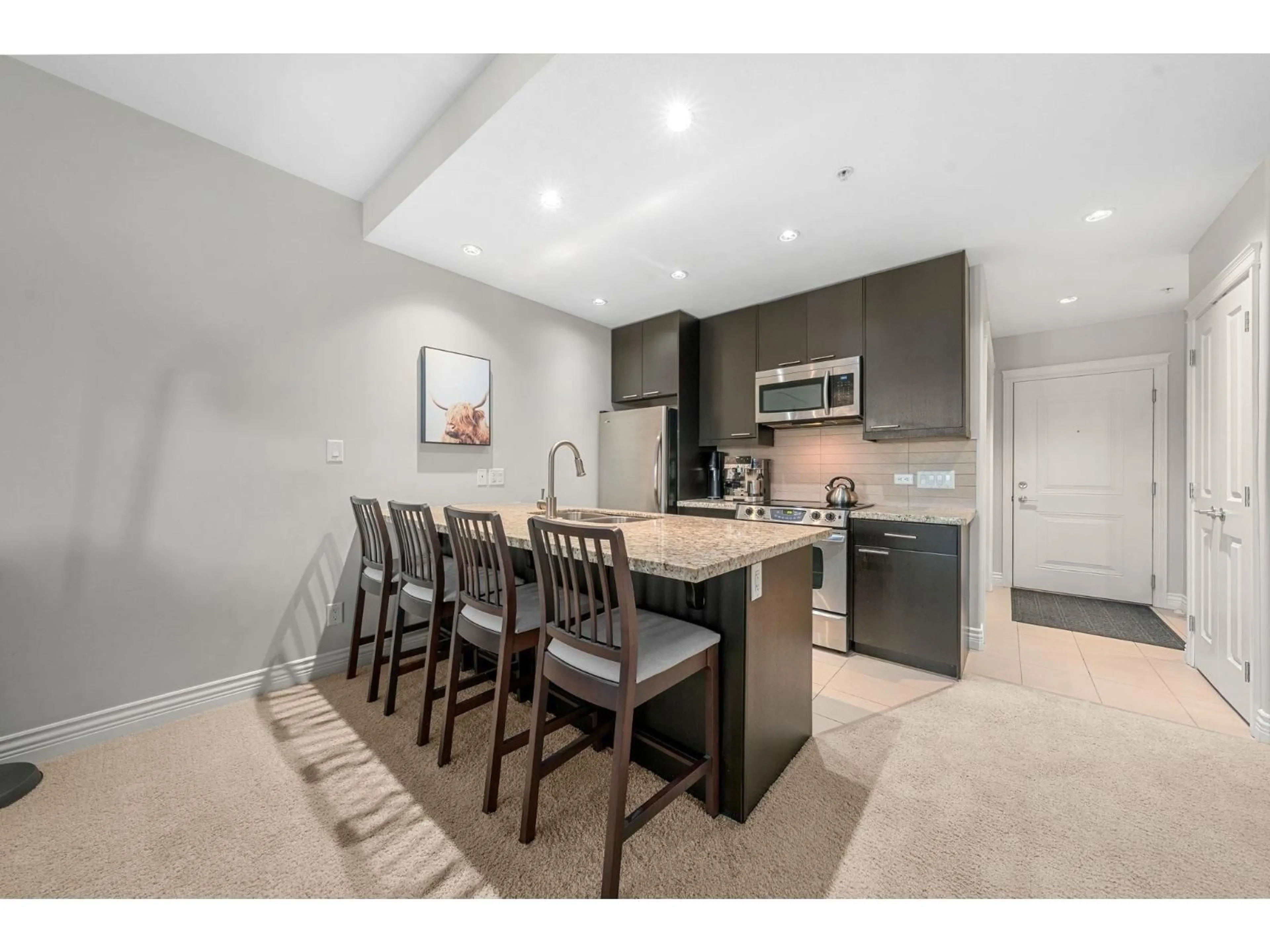 Open concept kitchen, unknown for 203 - 2970 KING GEORGE BOULEVARD, Surrey British Columbia V4P0E6