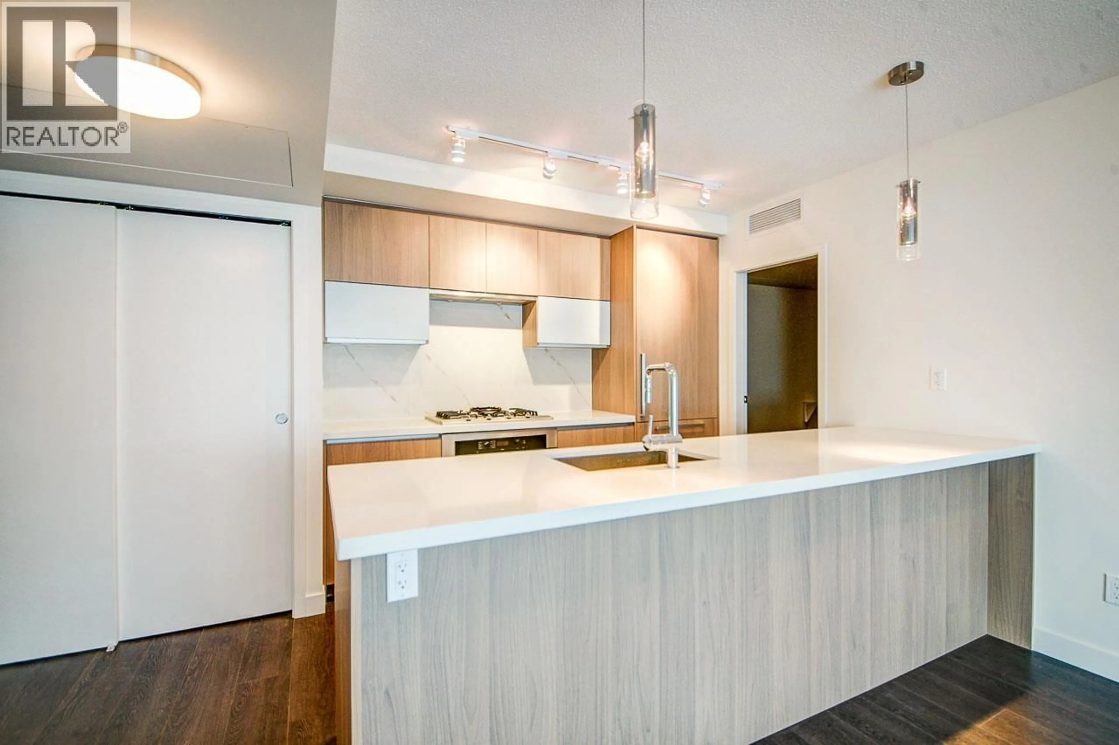 Open concept kitchen, wood/laminate floor for 1501 - 3131 KETCHESON ROAD, Richmond British Columbia V6X0N4
