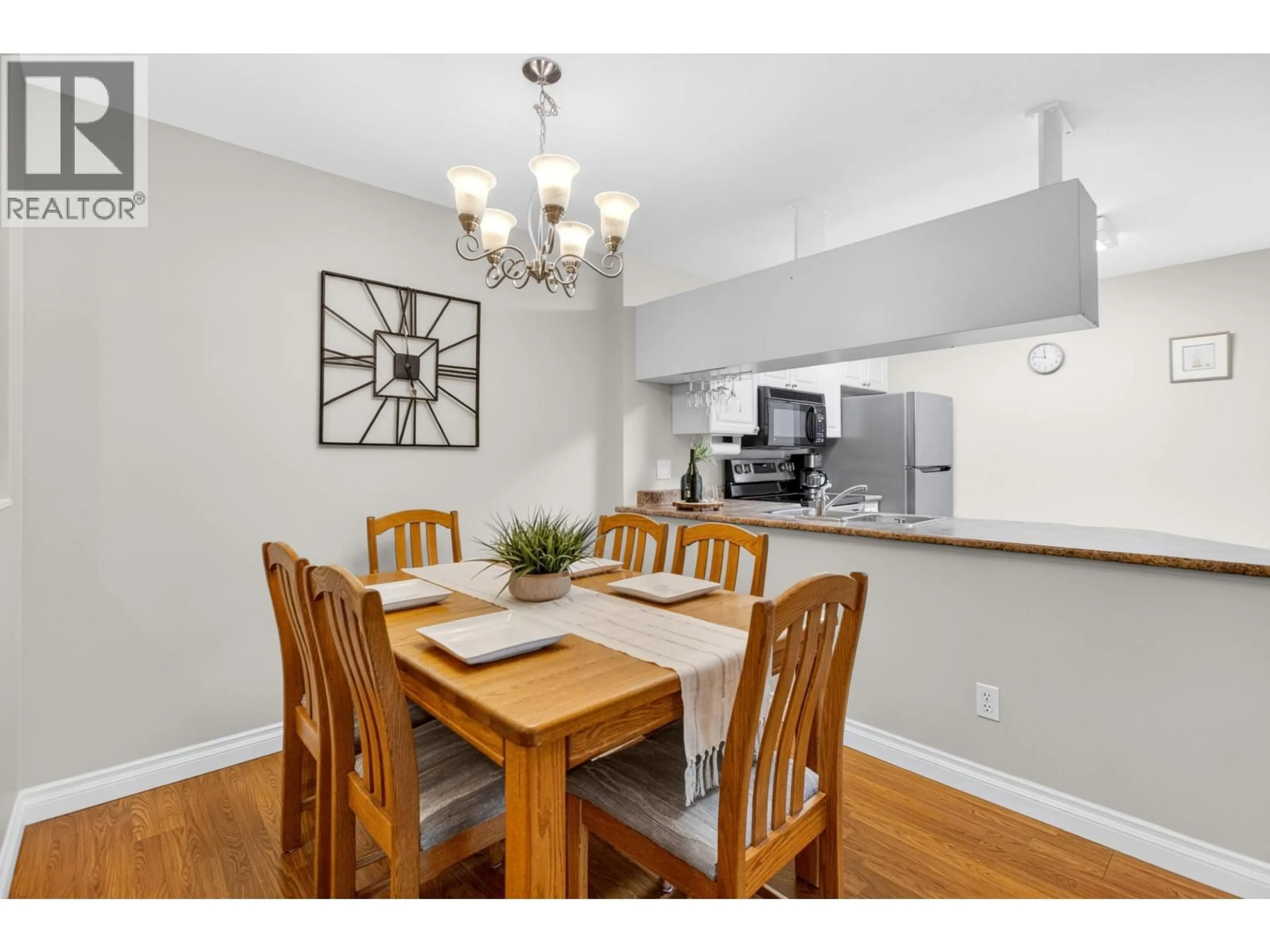 Dining room, wood/laminate floor for 103 - 11960 HARRIS ROAD, Pitt Meadows British Columbia V3Y2R1