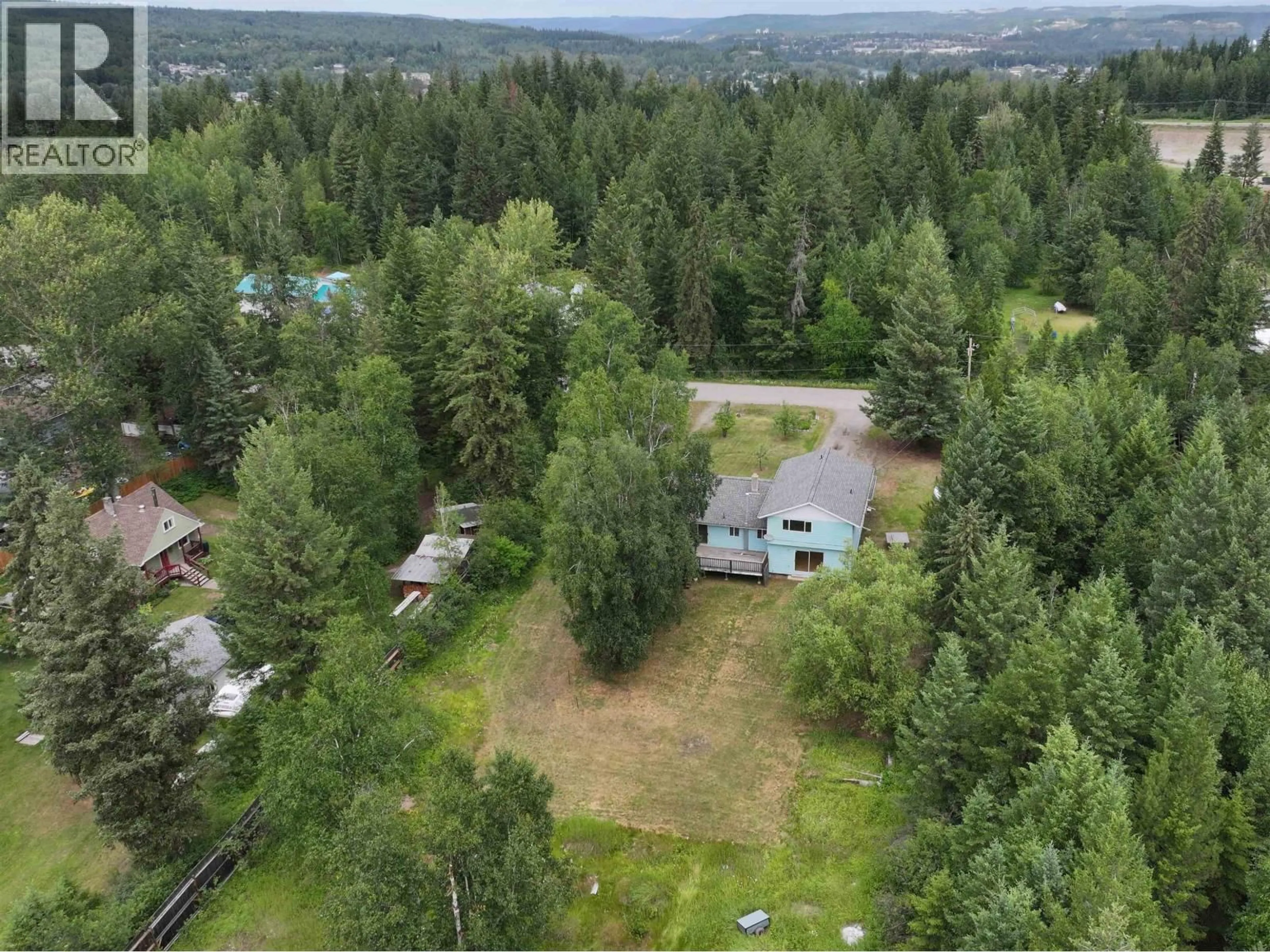 A pic from outside/outdoor area/front of a property/back of a property/a pic from drone, forest/trees view for 357 CARAGANA ROAD, Quesnel British Columbia V2J5P1
