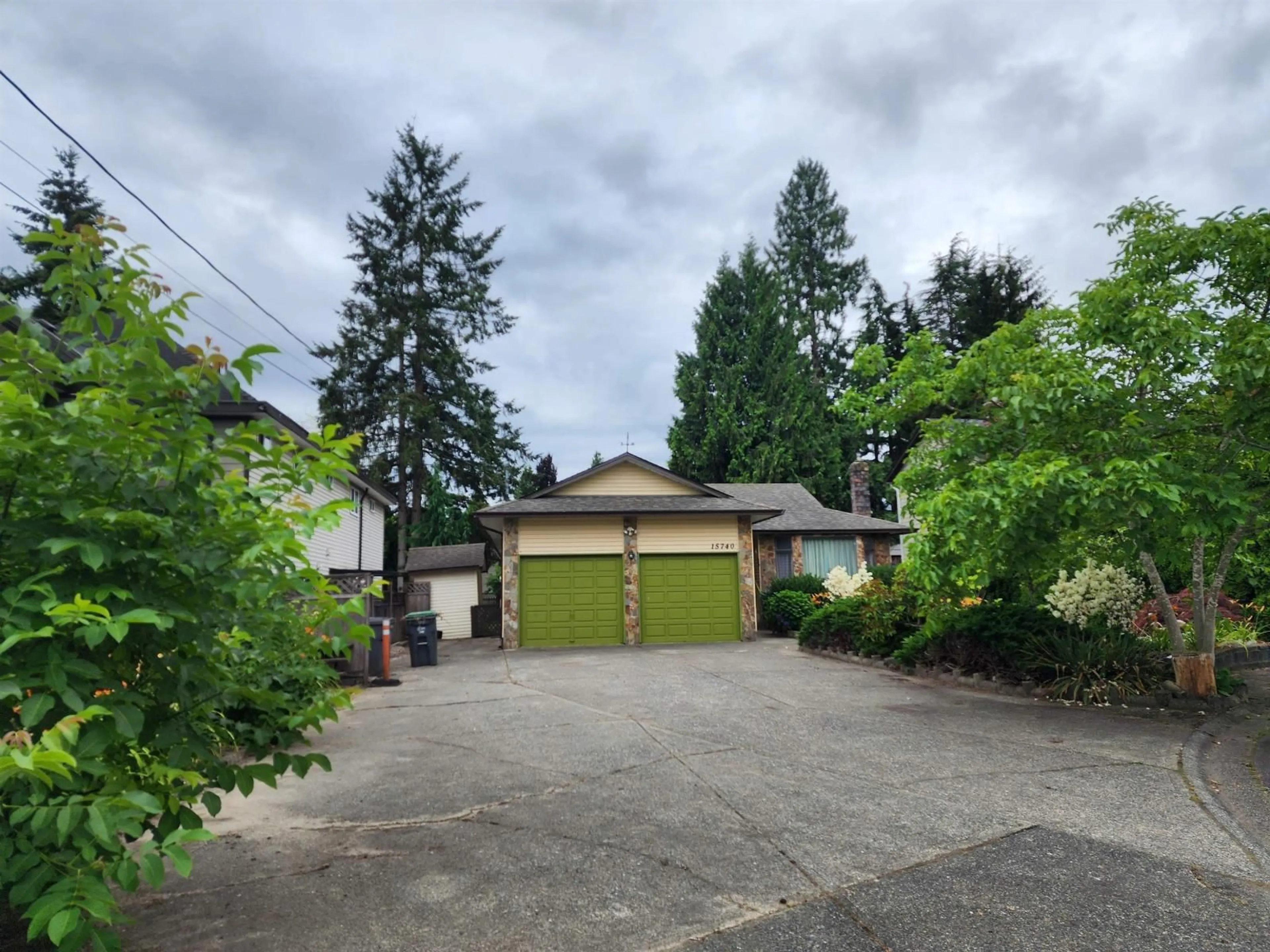 A pic from outside/outdoor area/front of a property/back of a property/a pic from drone, street for 15740 99 AVENUE, Surrey British Columbia V4N2A2