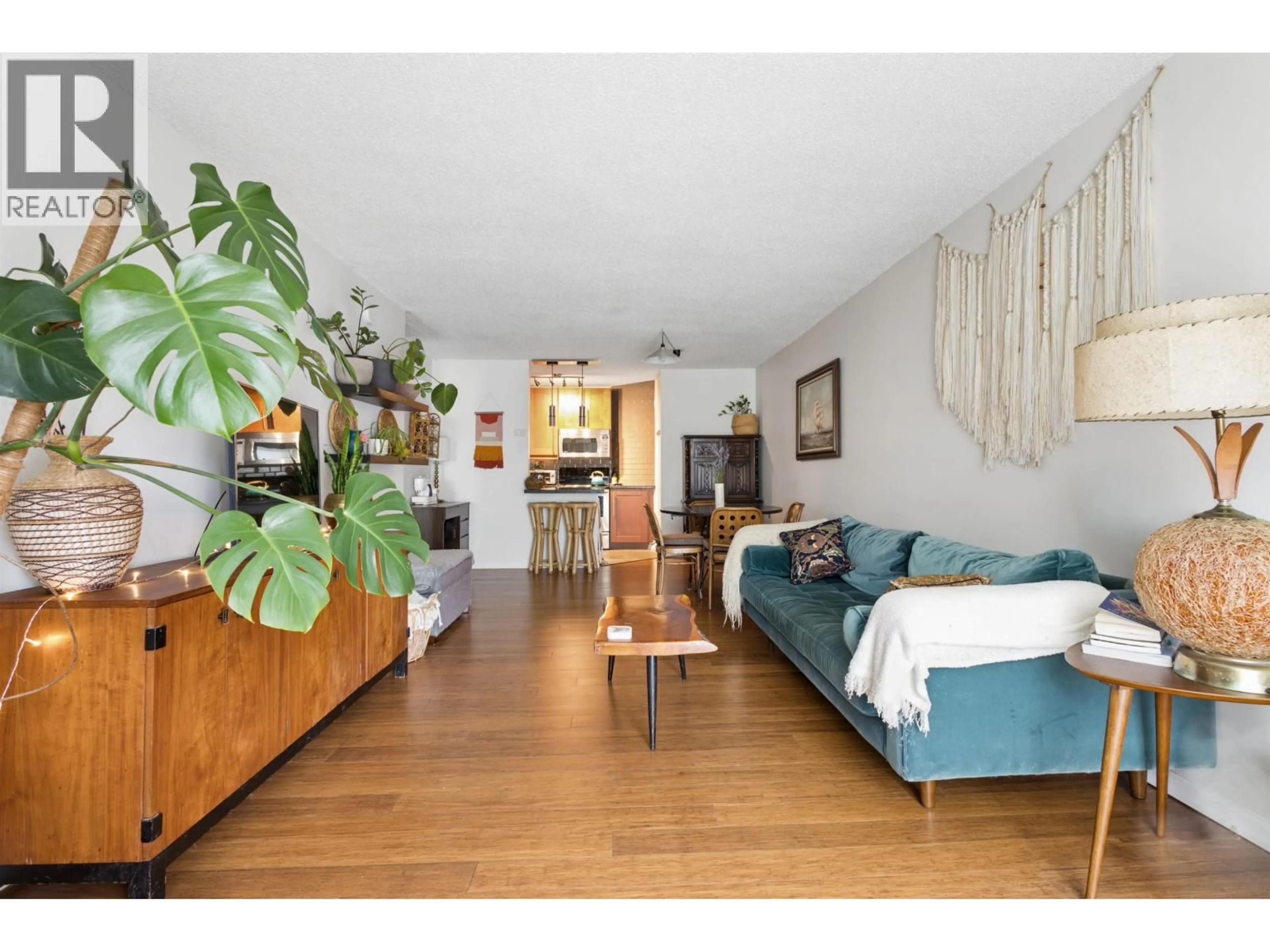 Living room with furniture, wood/laminate floor for 319 - 750 7TH AVENUE, Vancouver British Columbia V5T4H5
