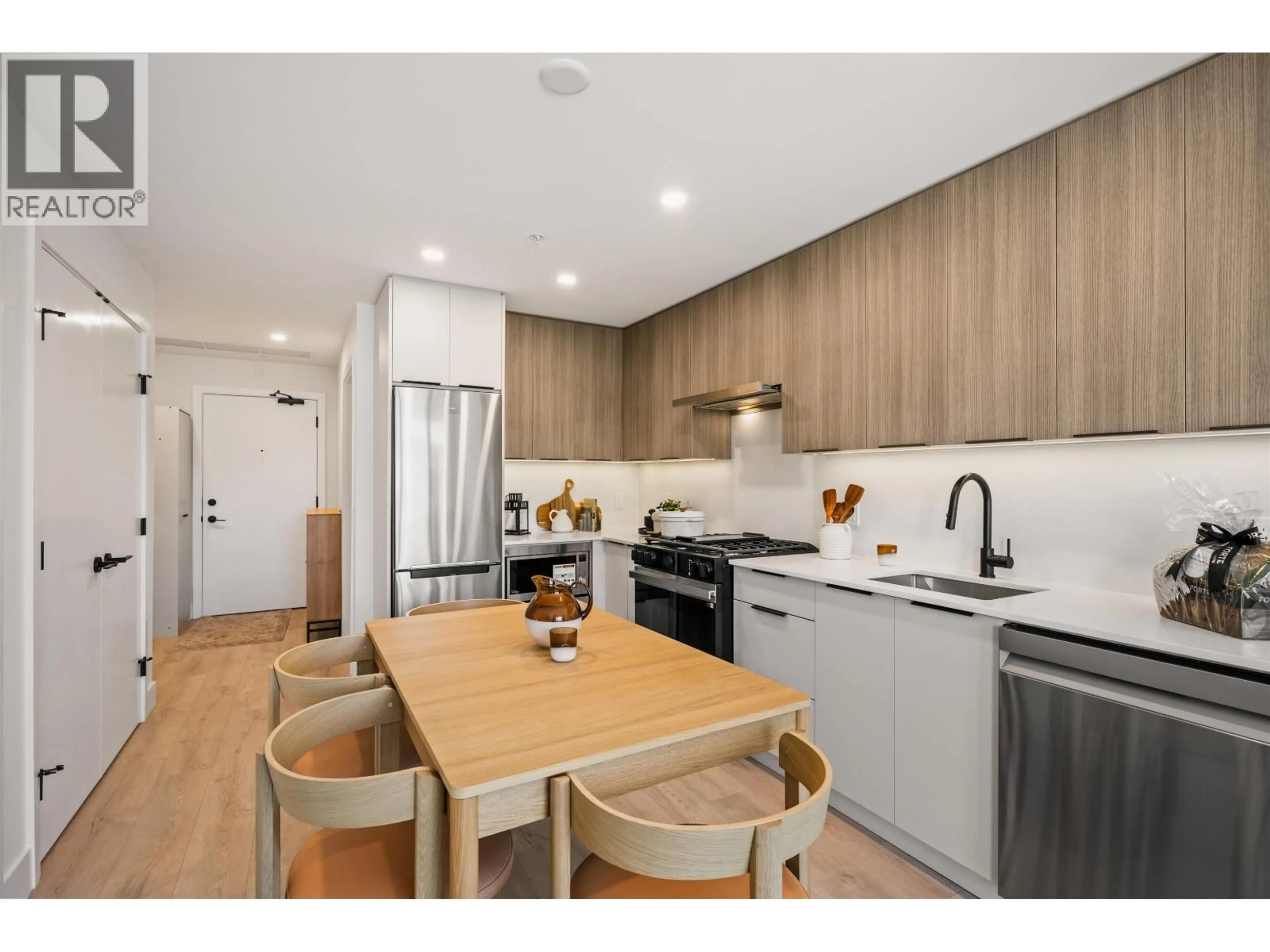 Open concept kitchen, wood/laminate floor for 306 - 111 BULLER STREET, Port Moody British Columbia V3H0P5