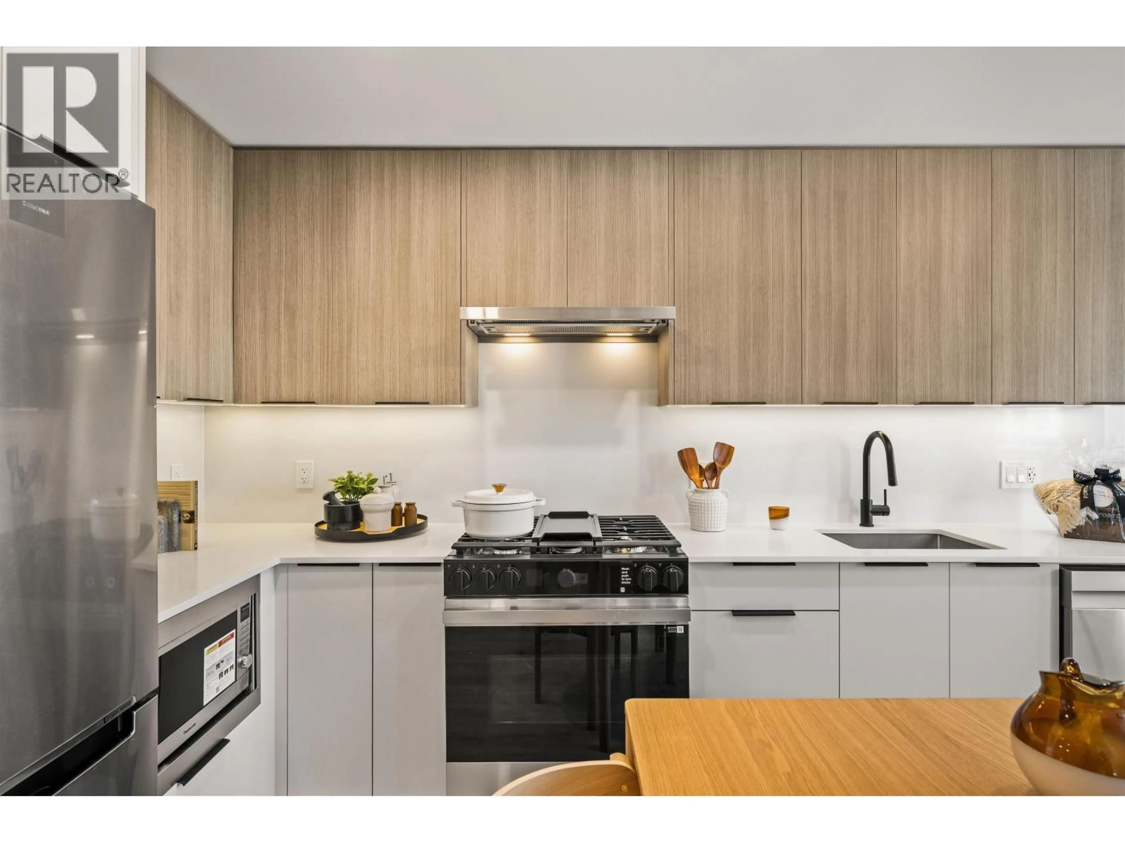 Contemporary kitchen, wood/laminate floor for 306 - 111 BULLER STREET, Port Moody British Columbia V3H0P5