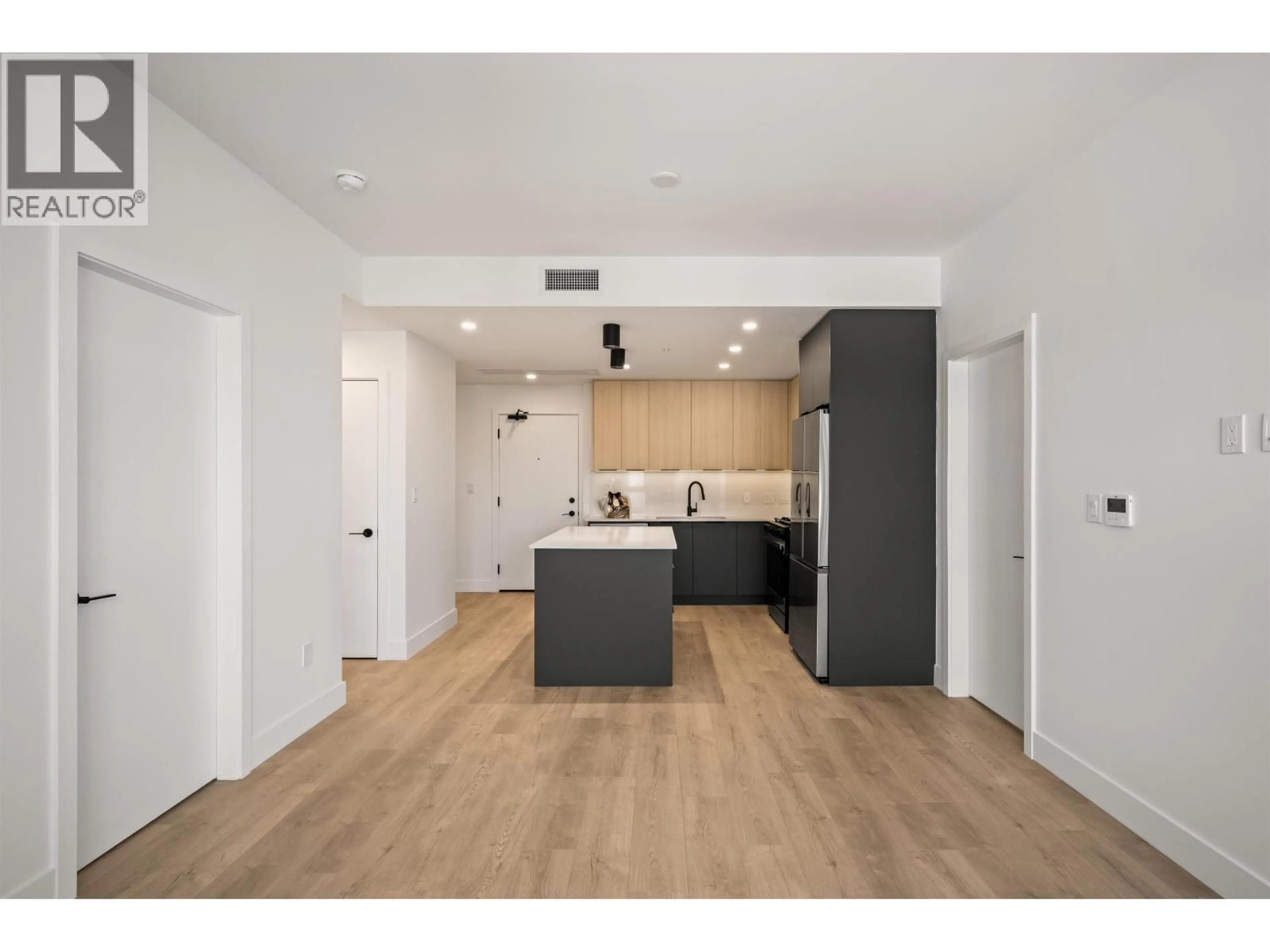 Open concept kitchen, wood/laminate floor for 603 - 111 BULLER STREET, Port Moody British Columbia V3H0P5