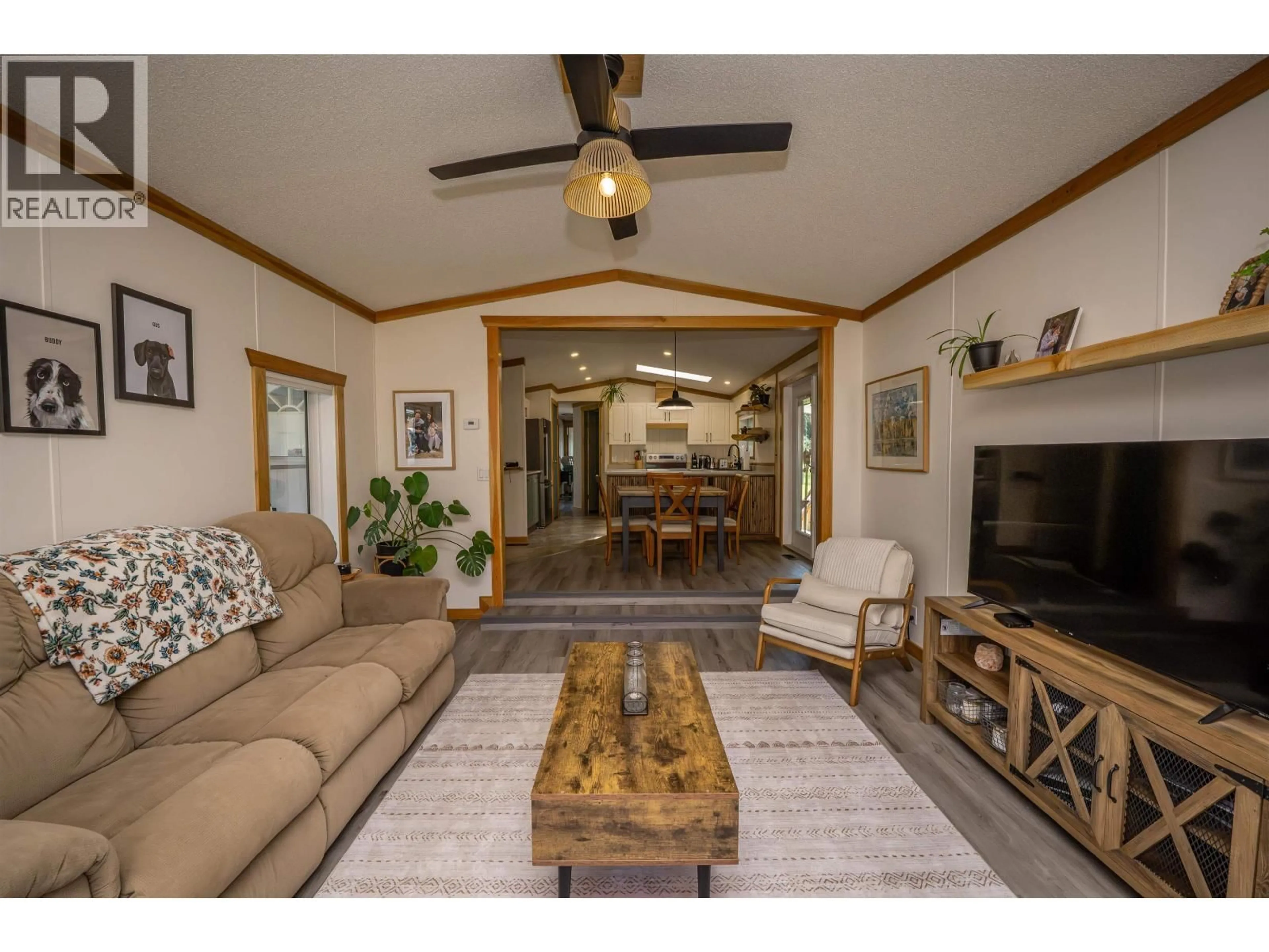 Living room with furniture, wood/laminate floor for 3235 PINE VALLEY ROAD, Williams Lake British Columbia V2G5C4