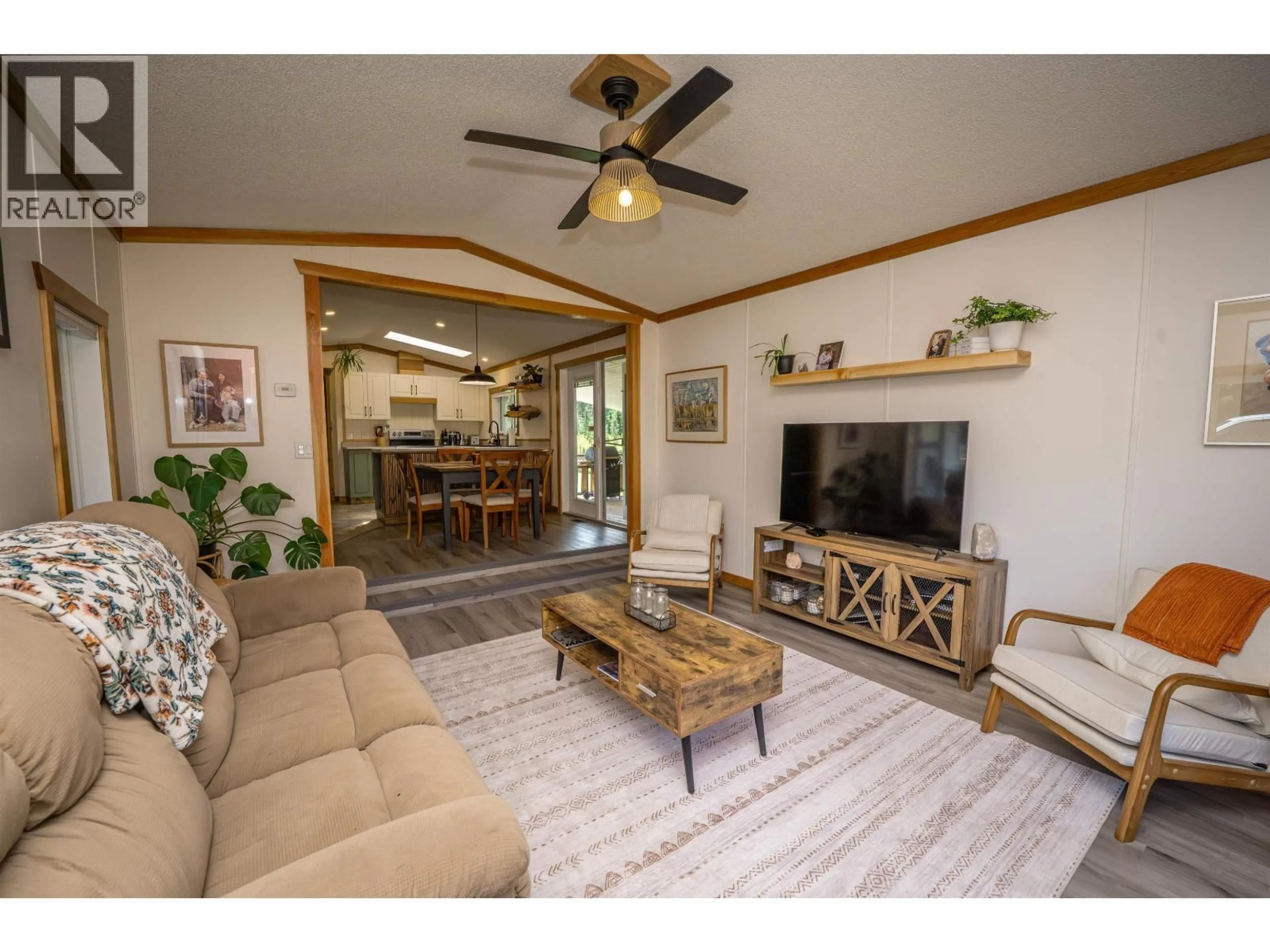 Living room with furniture, wood/laminate floor for 3235 PINE VALLEY ROAD, Williams Lake British Columbia V2G5C4