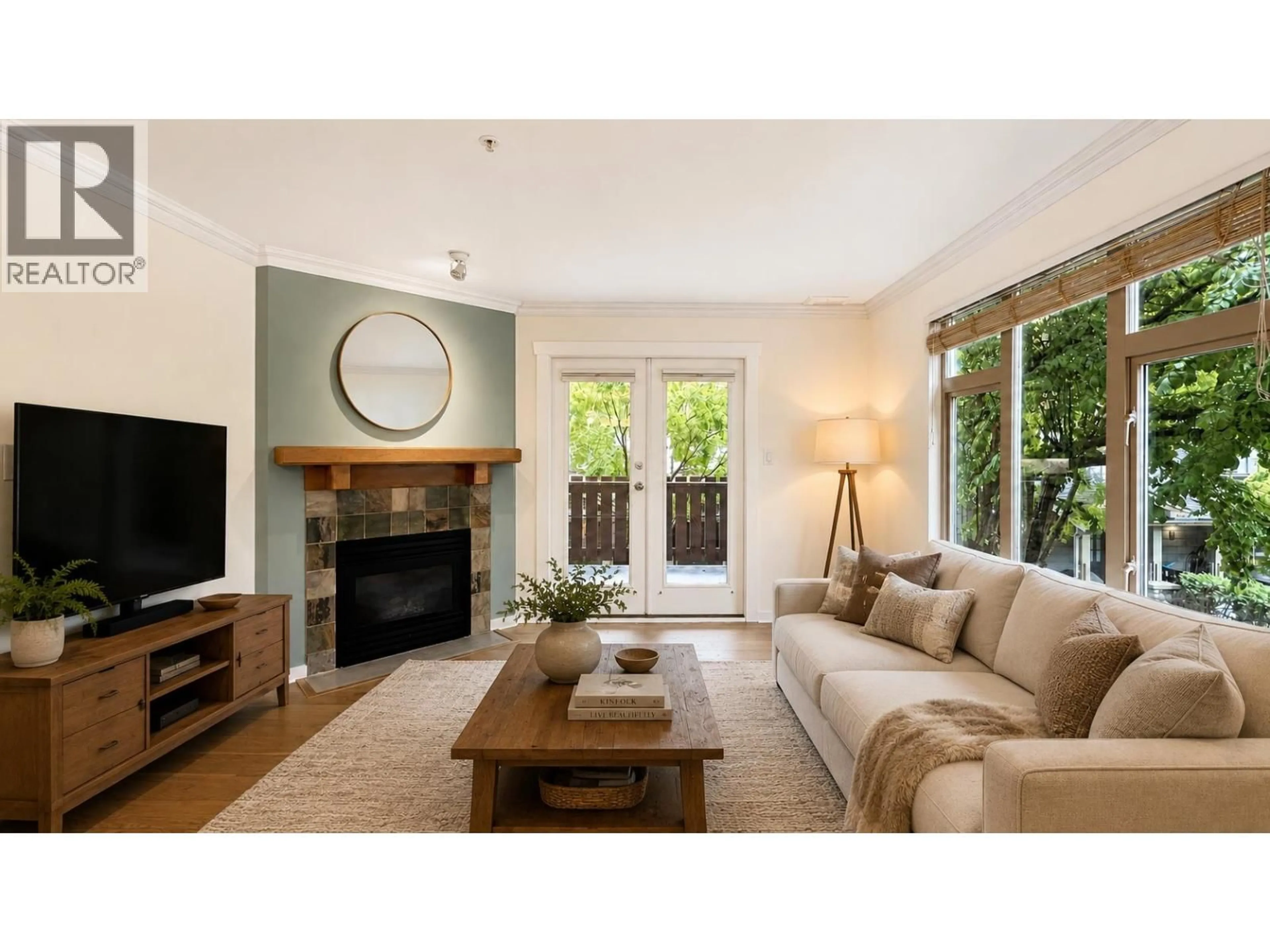 Living room with furniture, wood/laminate floor for 205 - 18 SMOKEY SMITH PLACE, New Westminster British Columbia V3L5V3