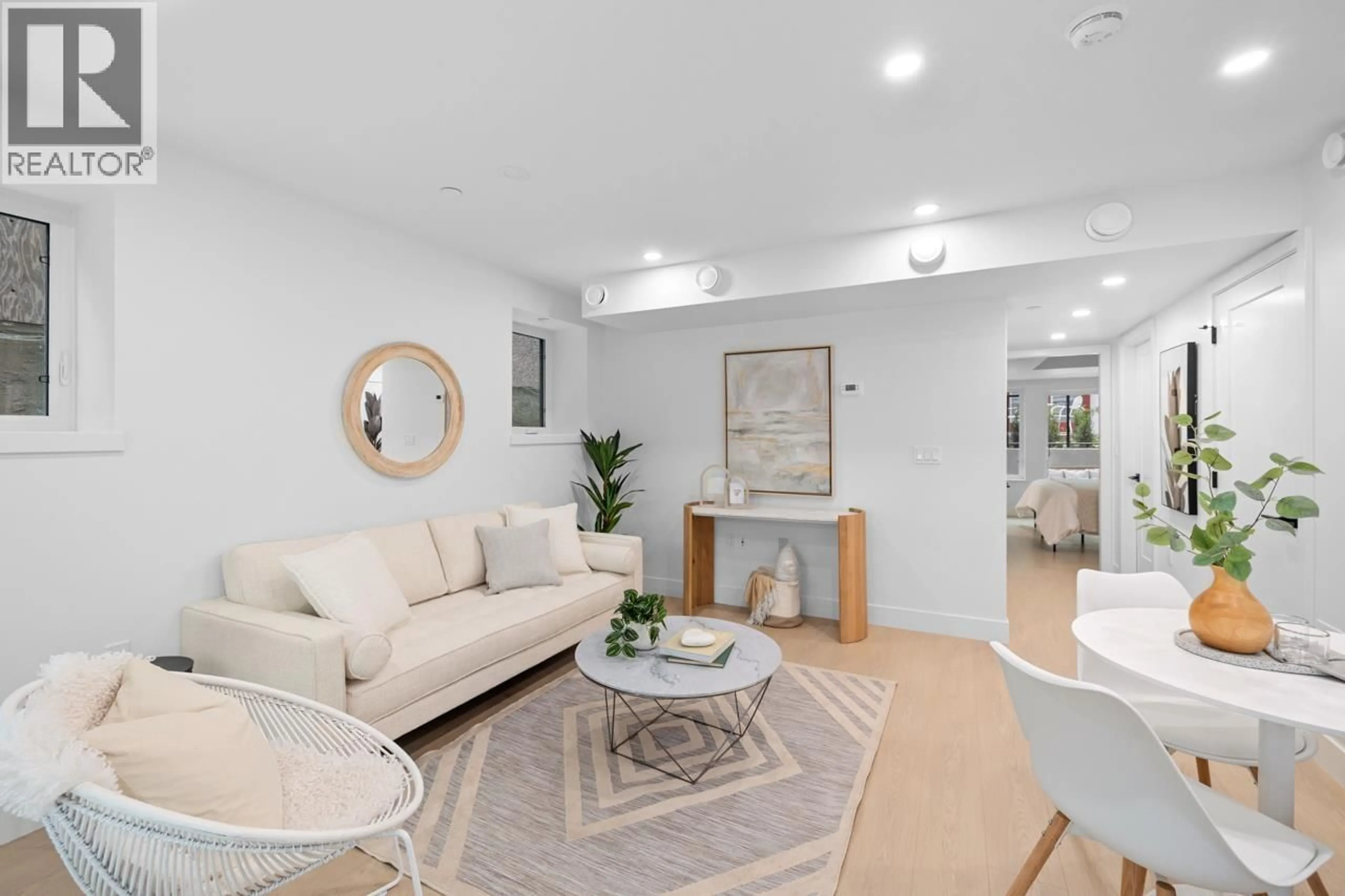 Living room with furniture, unknown for 102 - 2135 PENDER STREET, Vancouver British Columbia V5L1X3