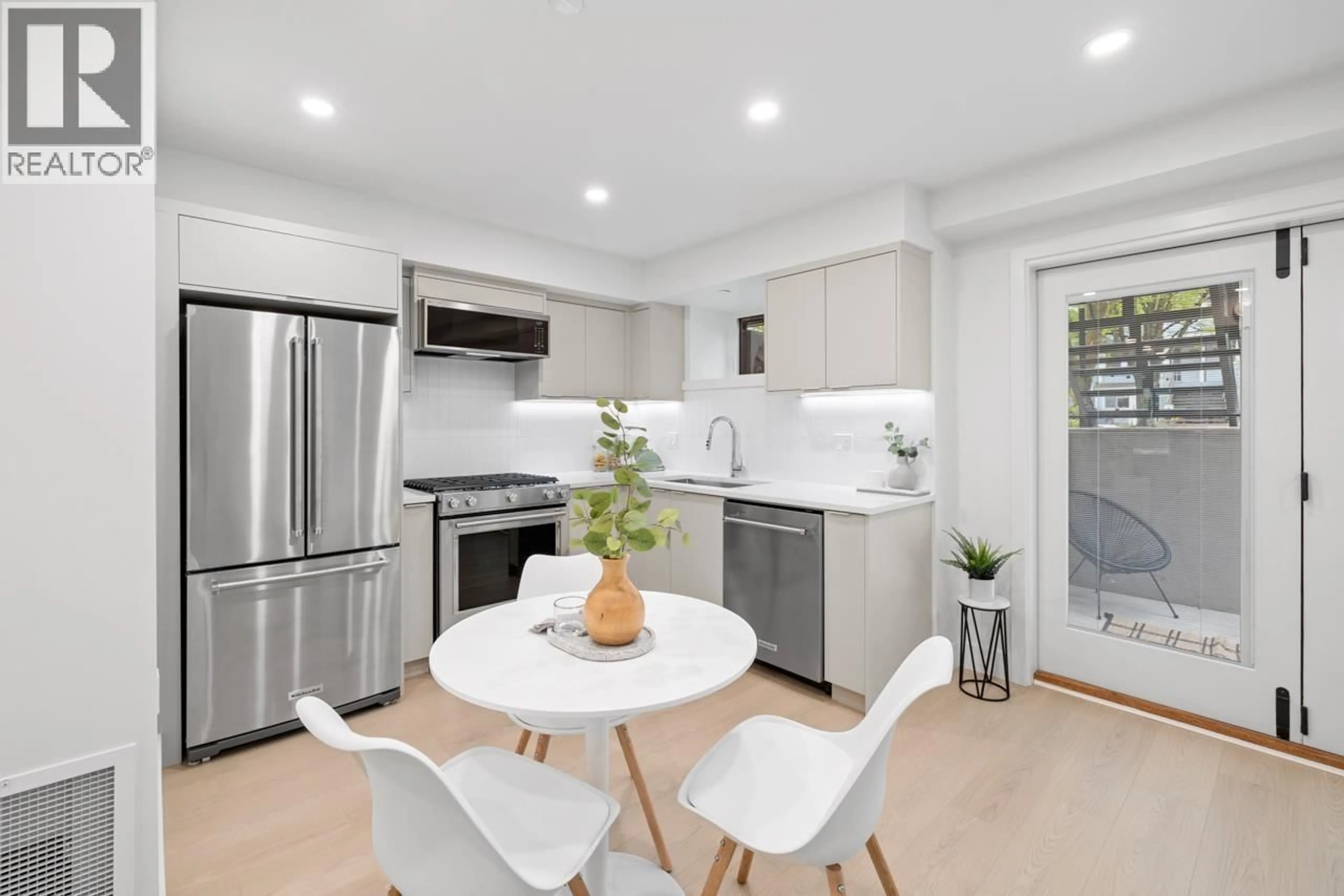Open concept kitchen, ceramic/tile floor for 102 - 2135 PENDER STREET, Vancouver British Columbia V5L1X3
