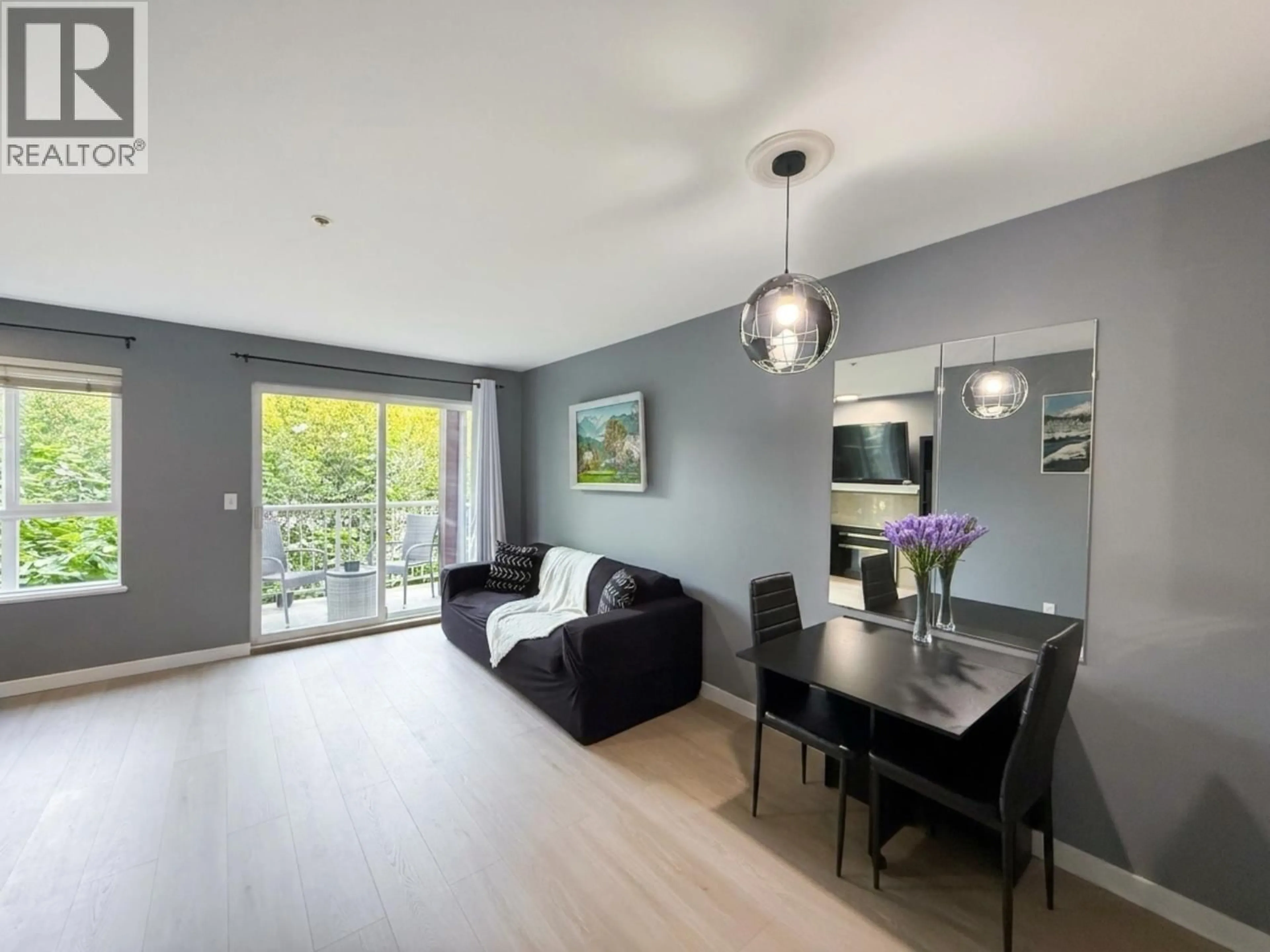 Living room with furniture, wood/laminate floor for 208 - 5355 BOUNDARY ROAD, Vancouver British Columbia V5R6G2