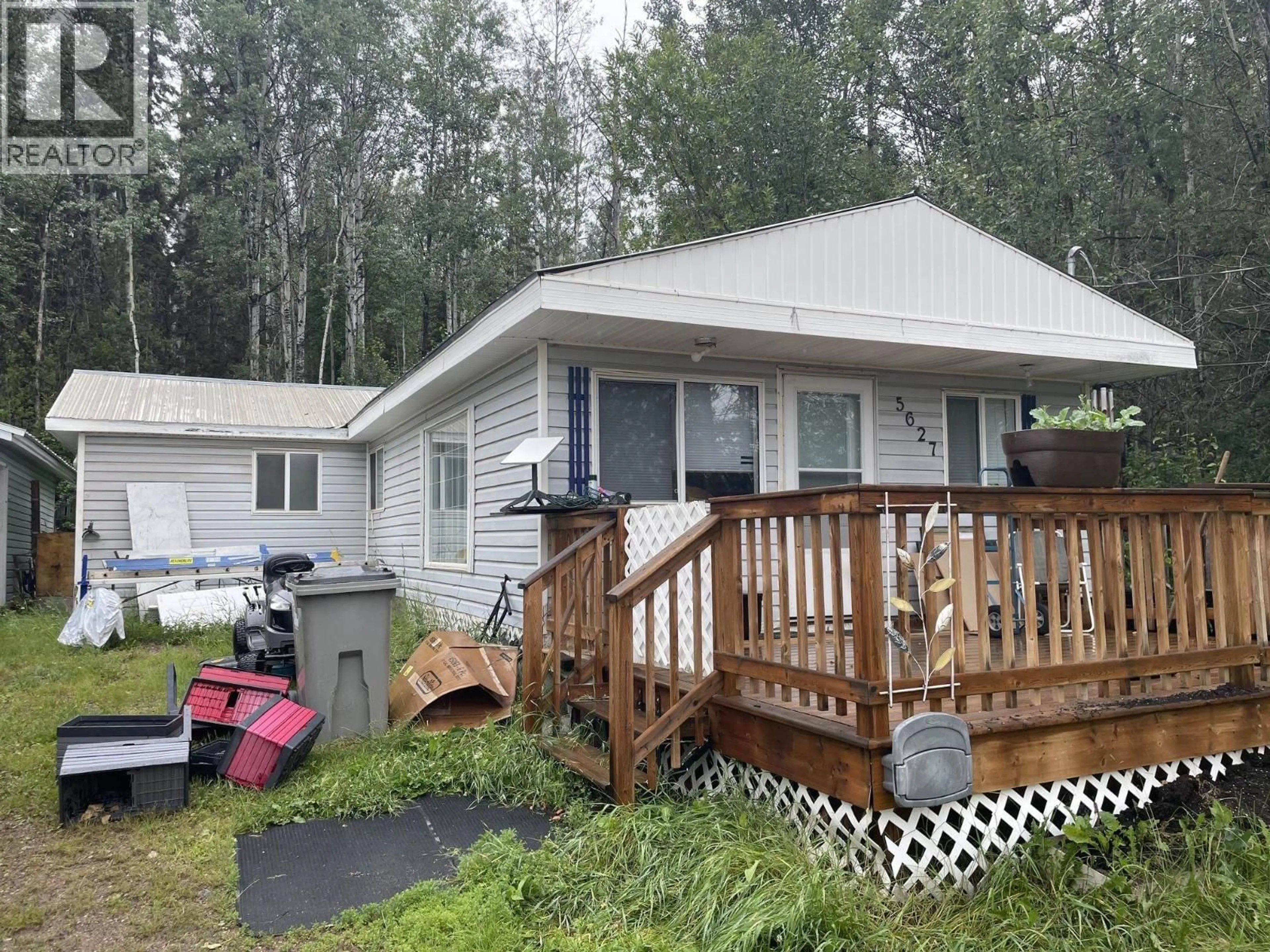 Home with vinyl exterior material, unknown for 5627 49 STREET, Fort Nelson British Columbia V0C1R0