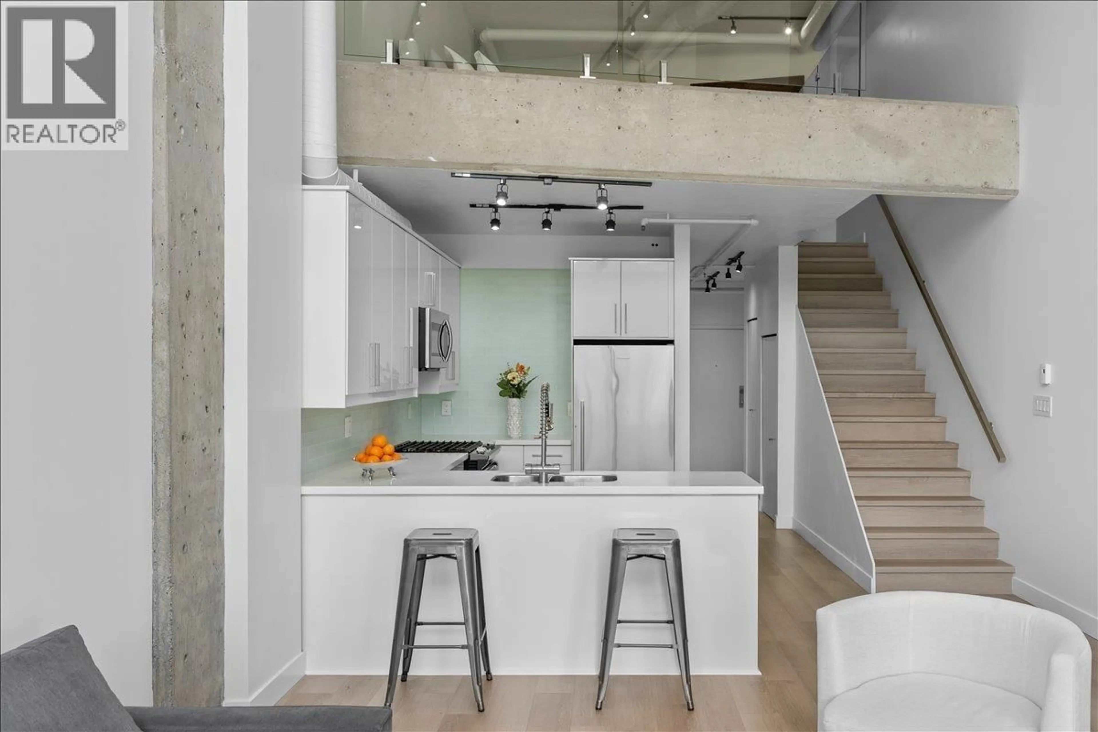 Contemporary kitchen, cement floor for 309 - 27 ALEXANDER STREET, Vancouver British Columbia V6A1B2