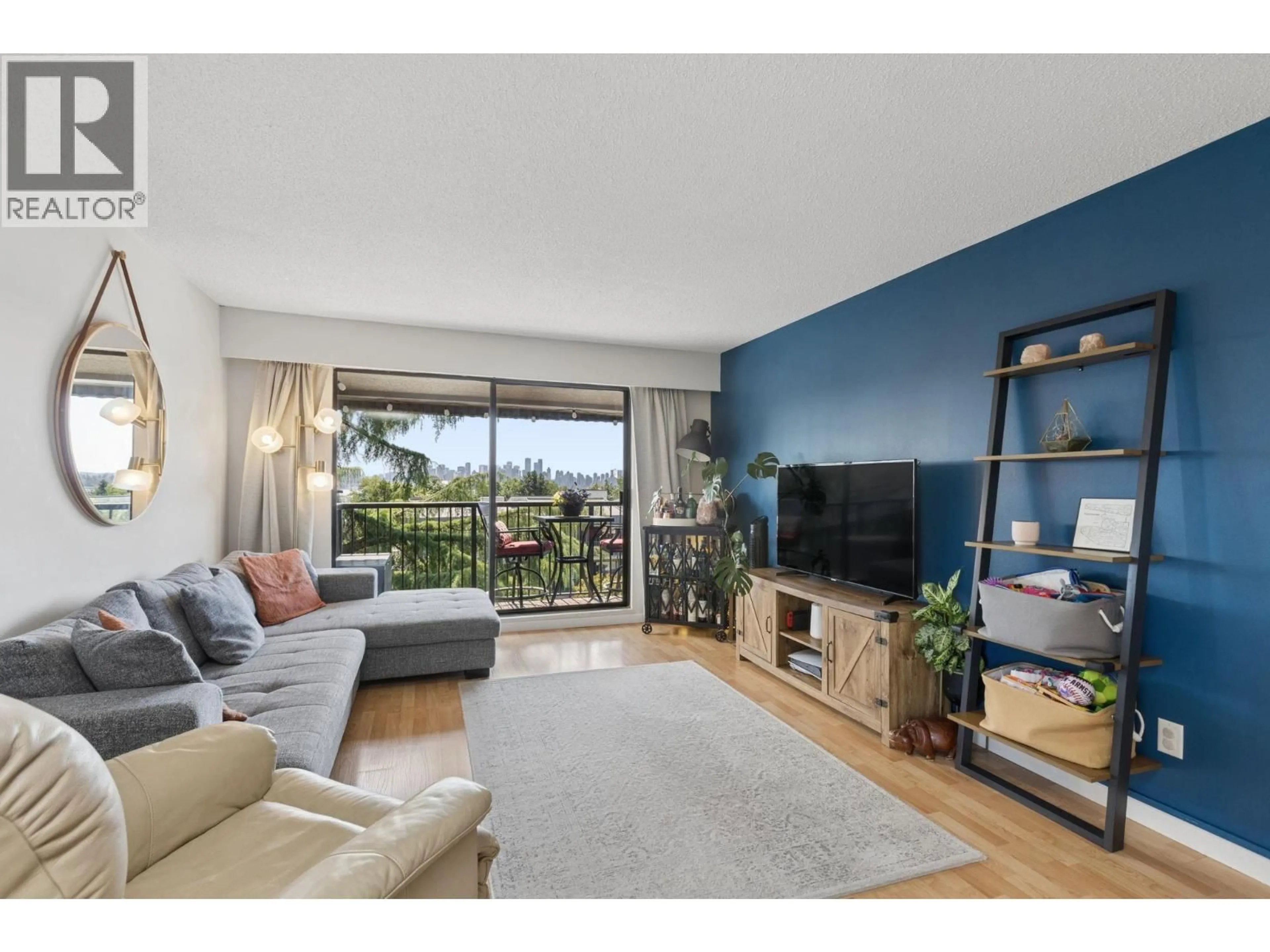 Living room with furniture, wood/laminate floor for 304 - 252 2ND STREET, North Vancouver British Columbia V7M1C8
