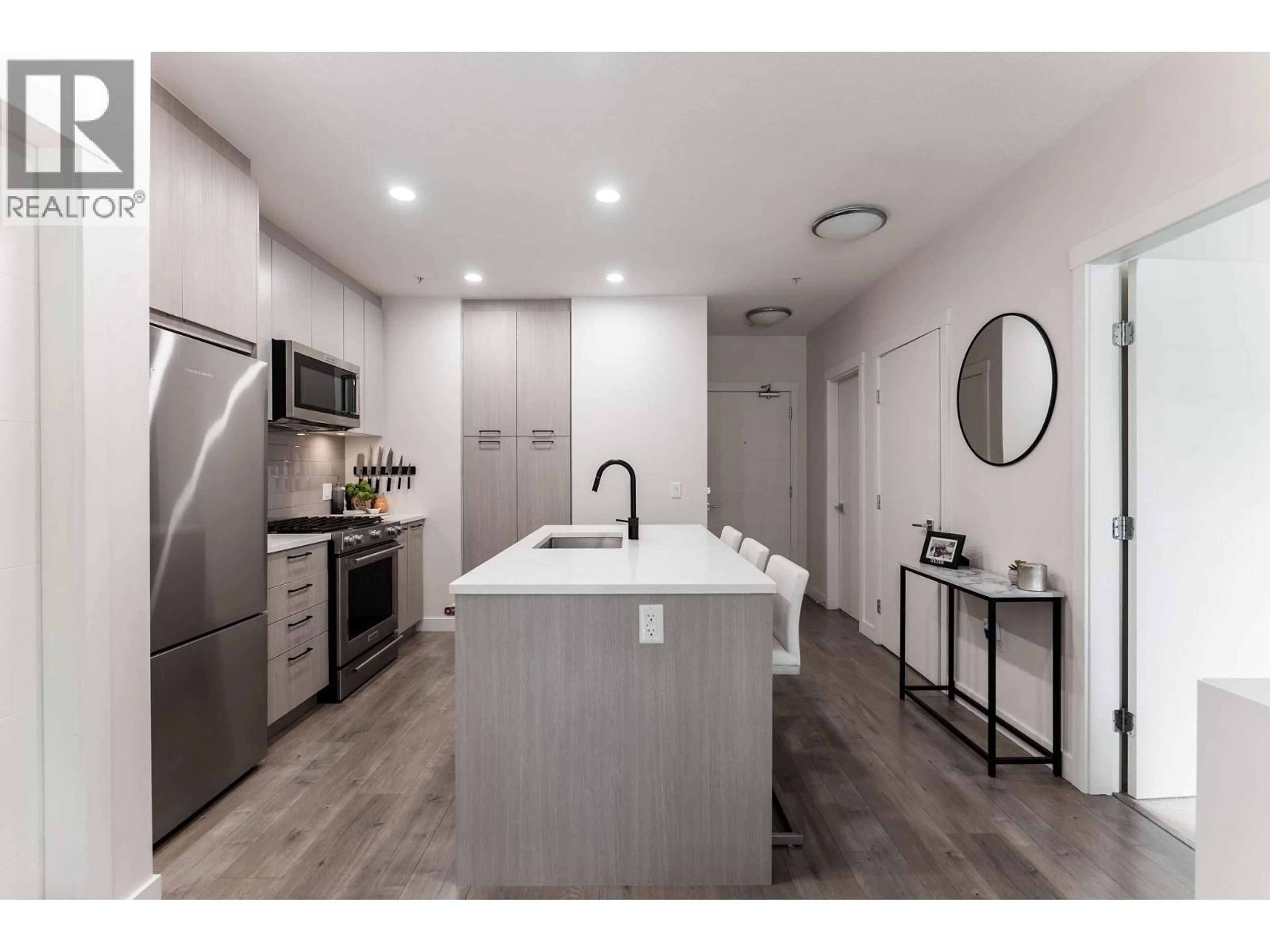 Open concept kitchen, ceramic/tile floor for 206 - 707 COMO LAKE AVENUE, Coquitlam British Columbia V3J0J5