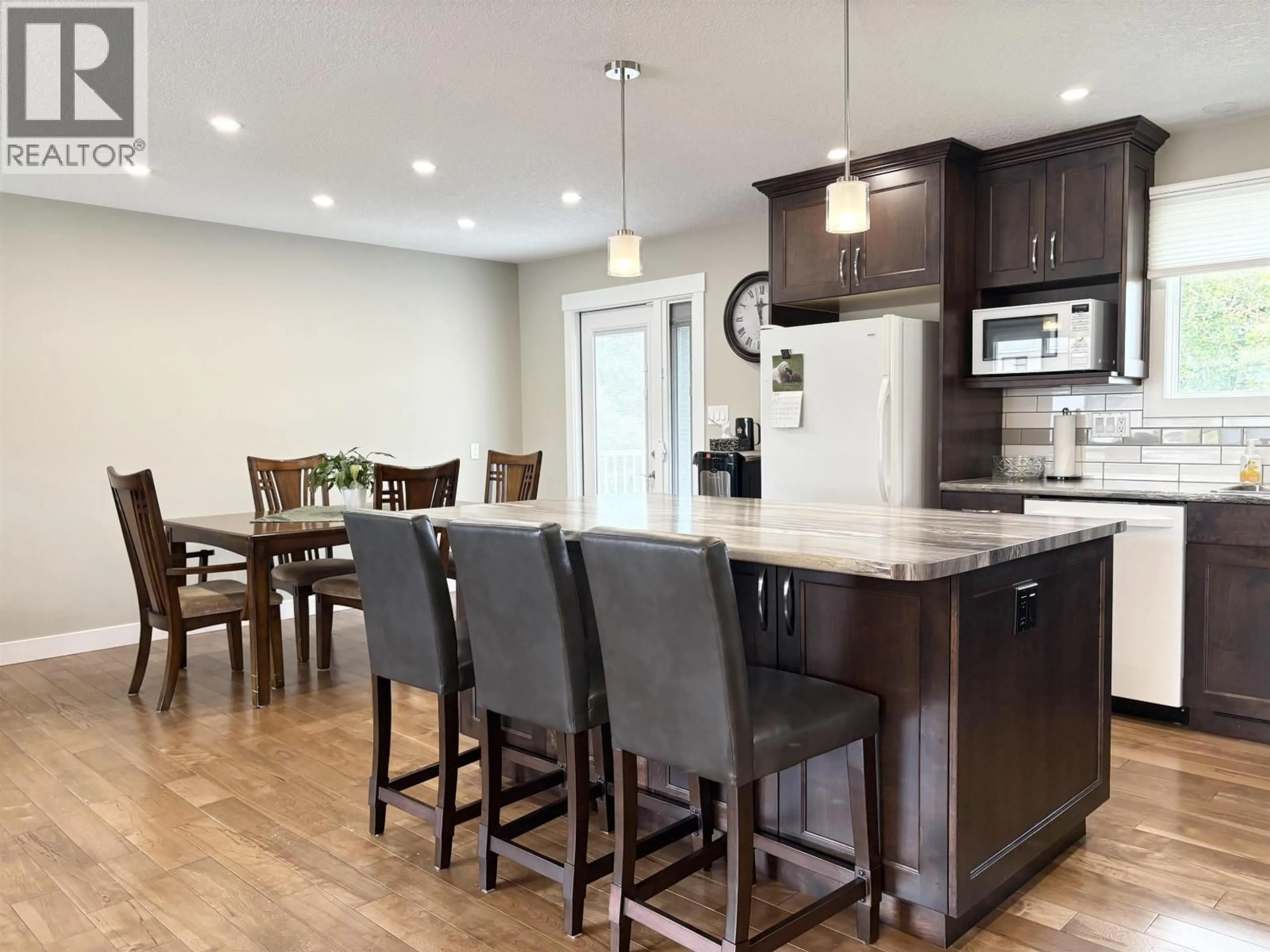 Open concept kitchen, wood/laminate floor for 2845 LONSDALE STREET, Prince George British Columbia V2L4W9