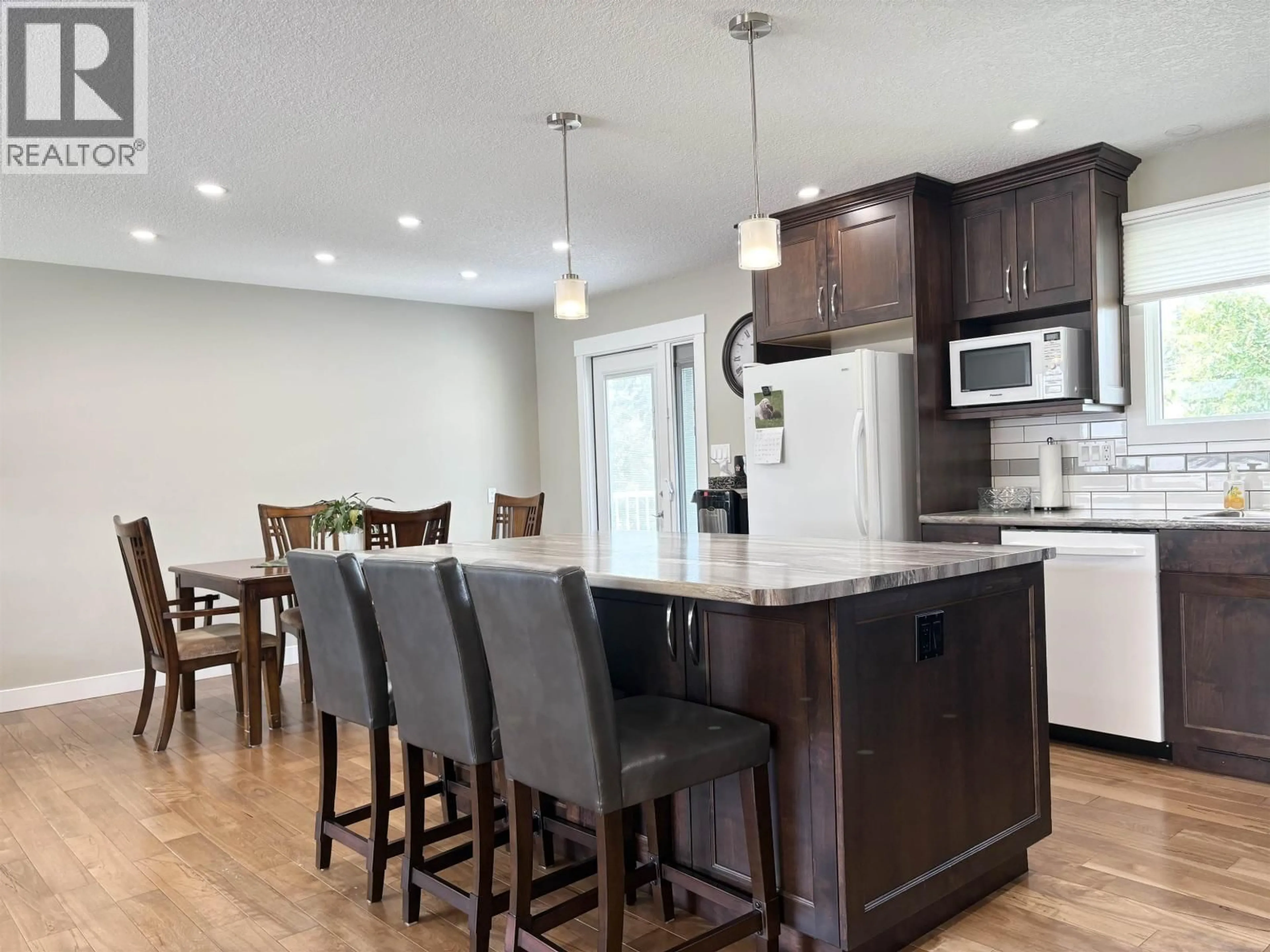 Open concept kitchen, wood/laminate floor for 2845 LONSDALE STREET, Prince George British Columbia V2L4W9