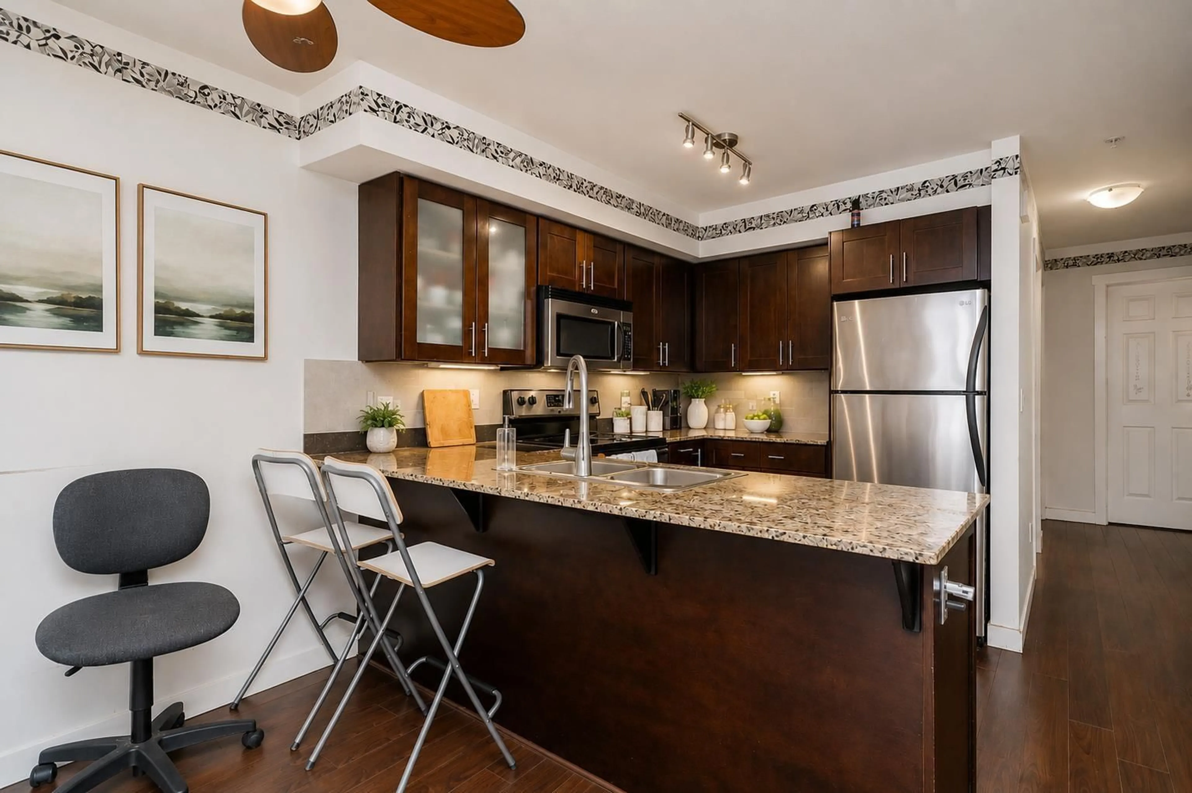 Open concept kitchen, unknown for 103 - 13958 108 AVENUE, Surrey British Columbia V3T0B4