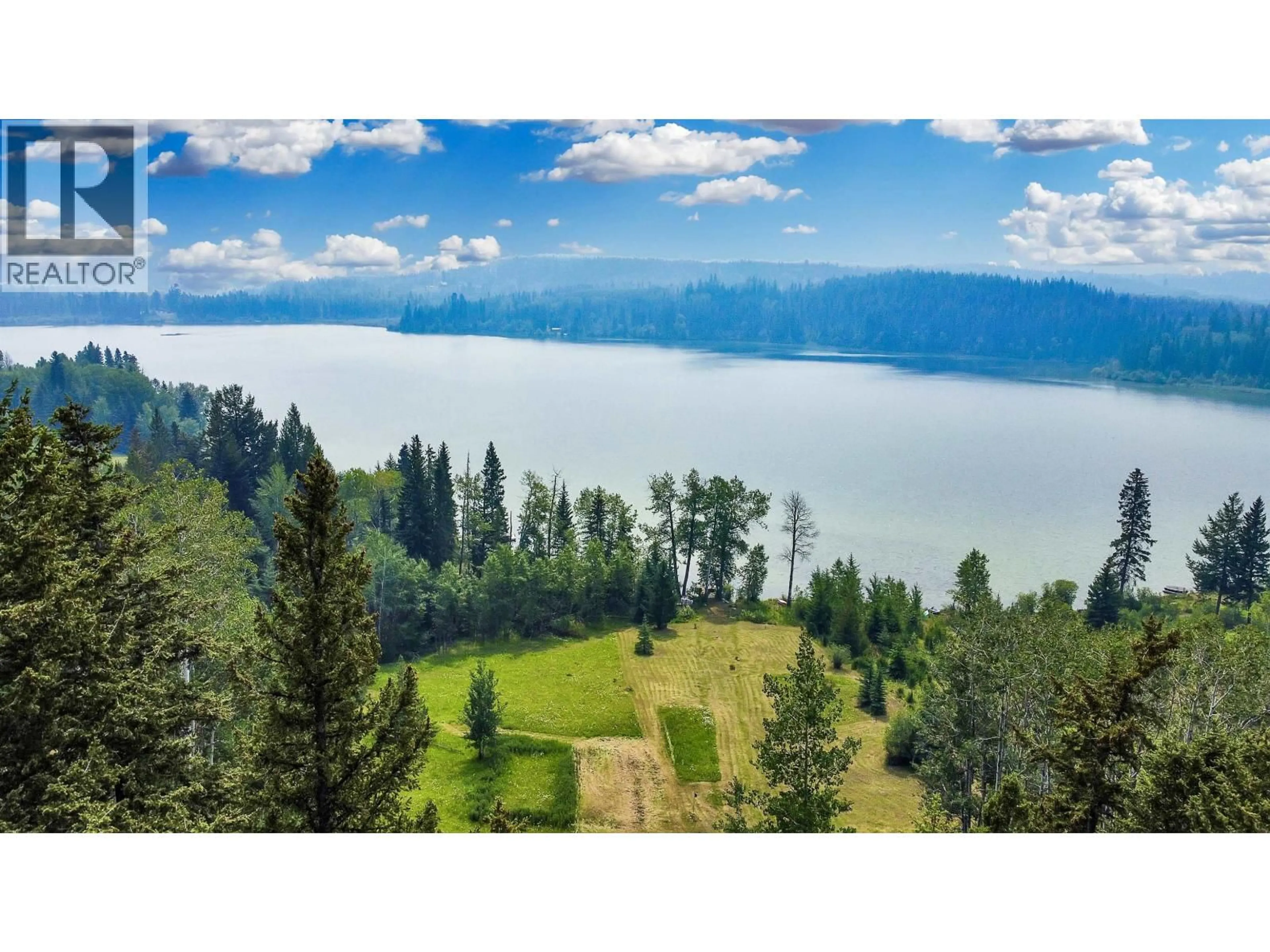 A pic from outside/outdoor area/front of a property/back of a property/a pic from drone, water/lake/river/ocean view for 7786 BRIDGE LAKE ROAD, Bridge Lake British Columbia V0K1X2