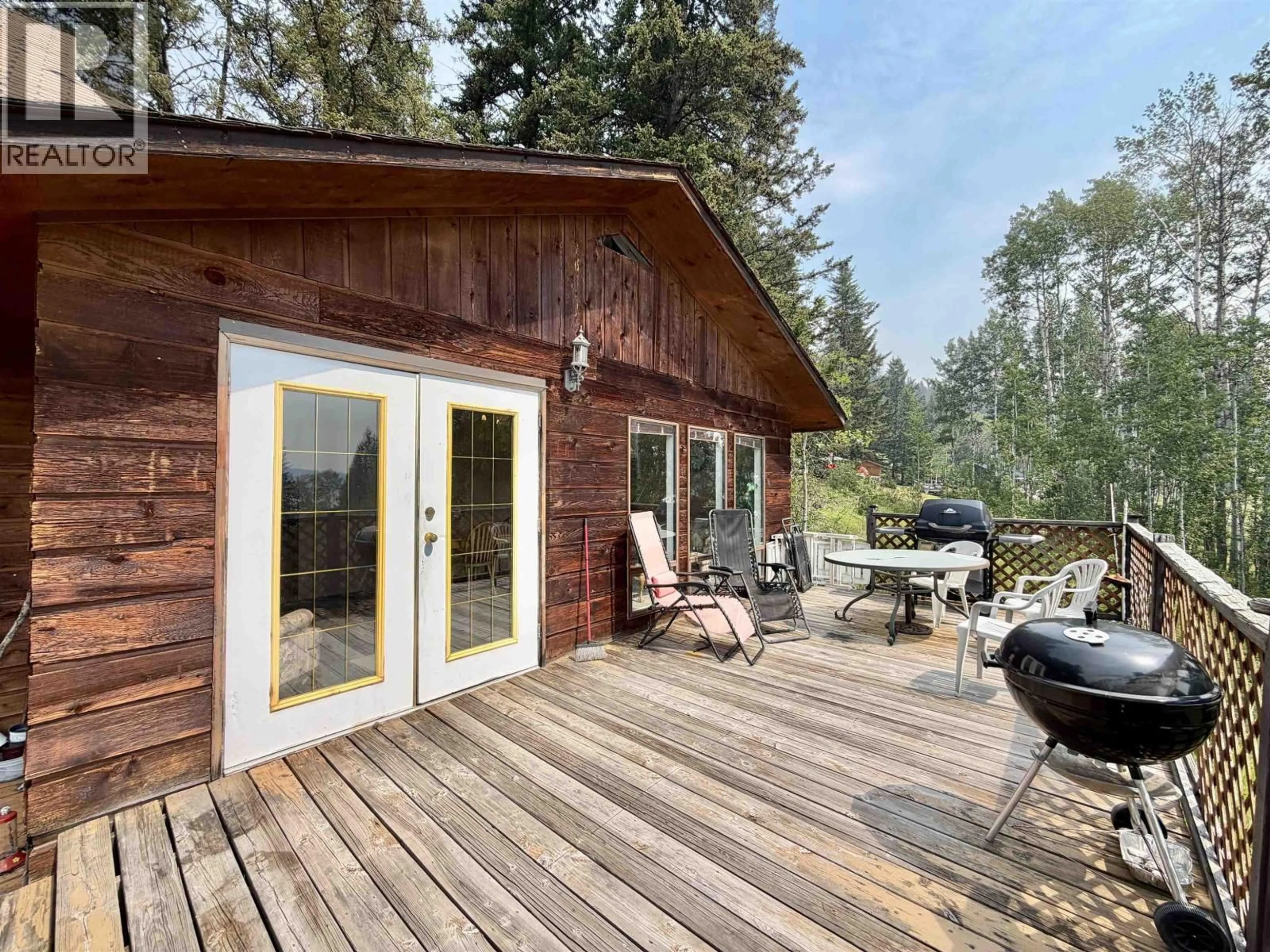 Patio, forest/trees view for 7786 BRIDGE LAKE ROAD, Bridge Lake British Columbia V0K1X2