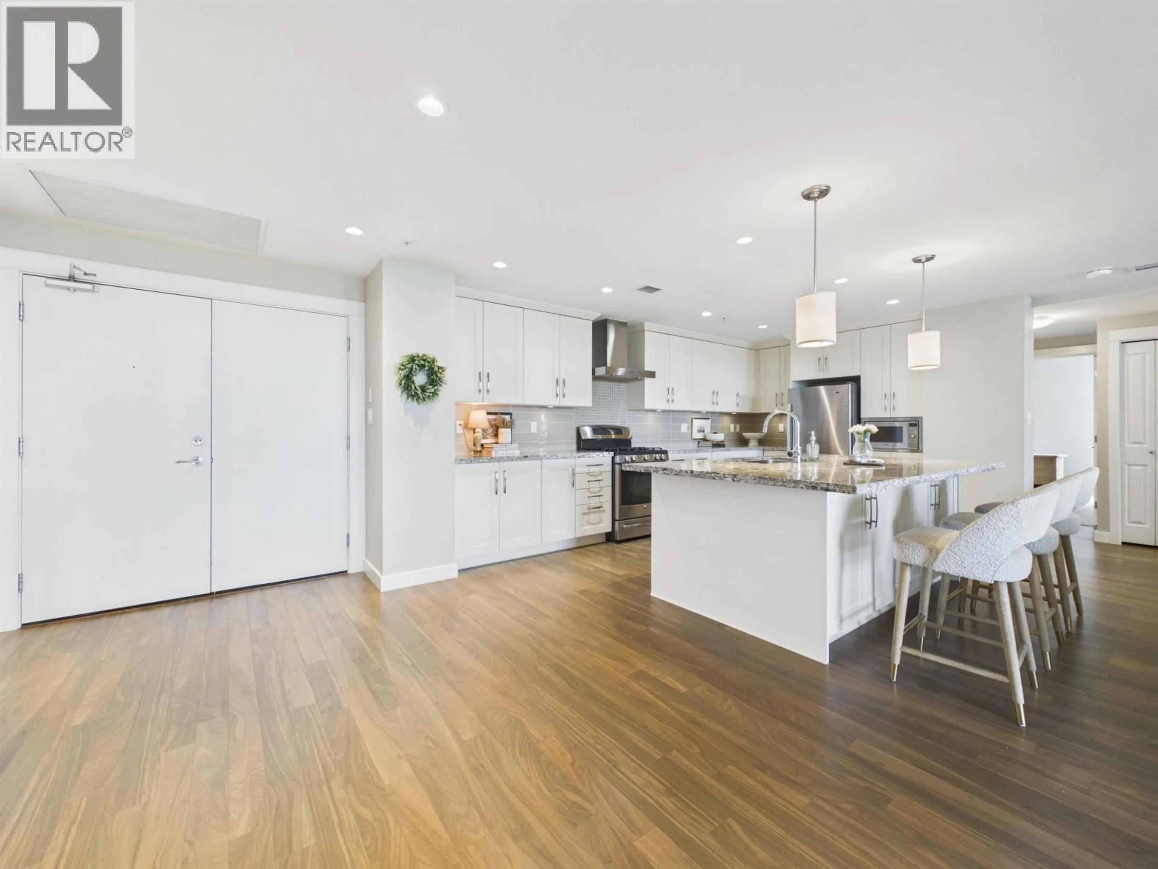 Open concept kitchen, wood/laminate floor for 210 - 5055 SPRINGS BOULEVARD, Tsawwassen British Columbia V4M0A5