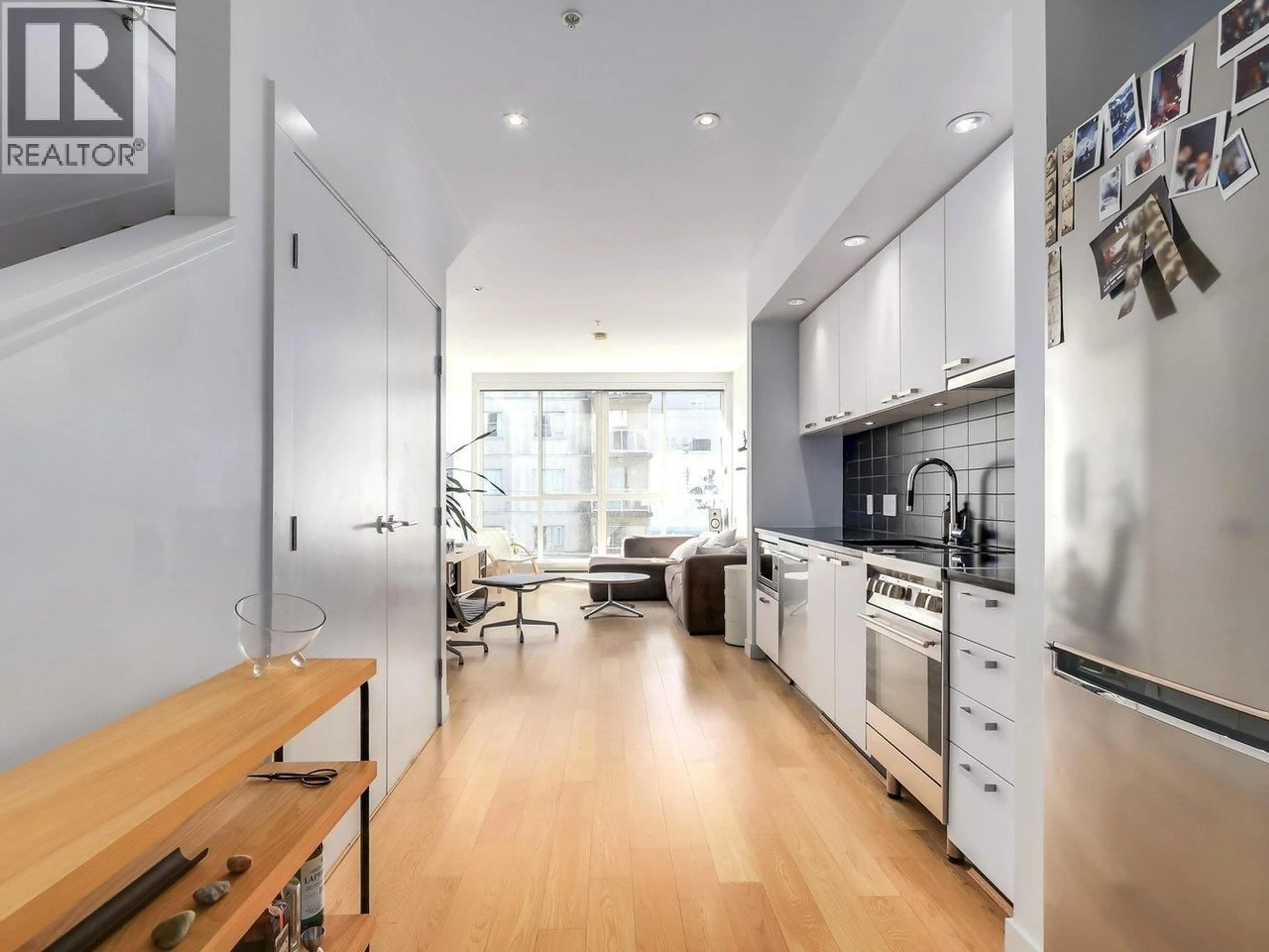Open concept kitchen, wood/laminate floor for 312 - 557 CORDOVA STREET, Vancouver British Columbia V6A1L8