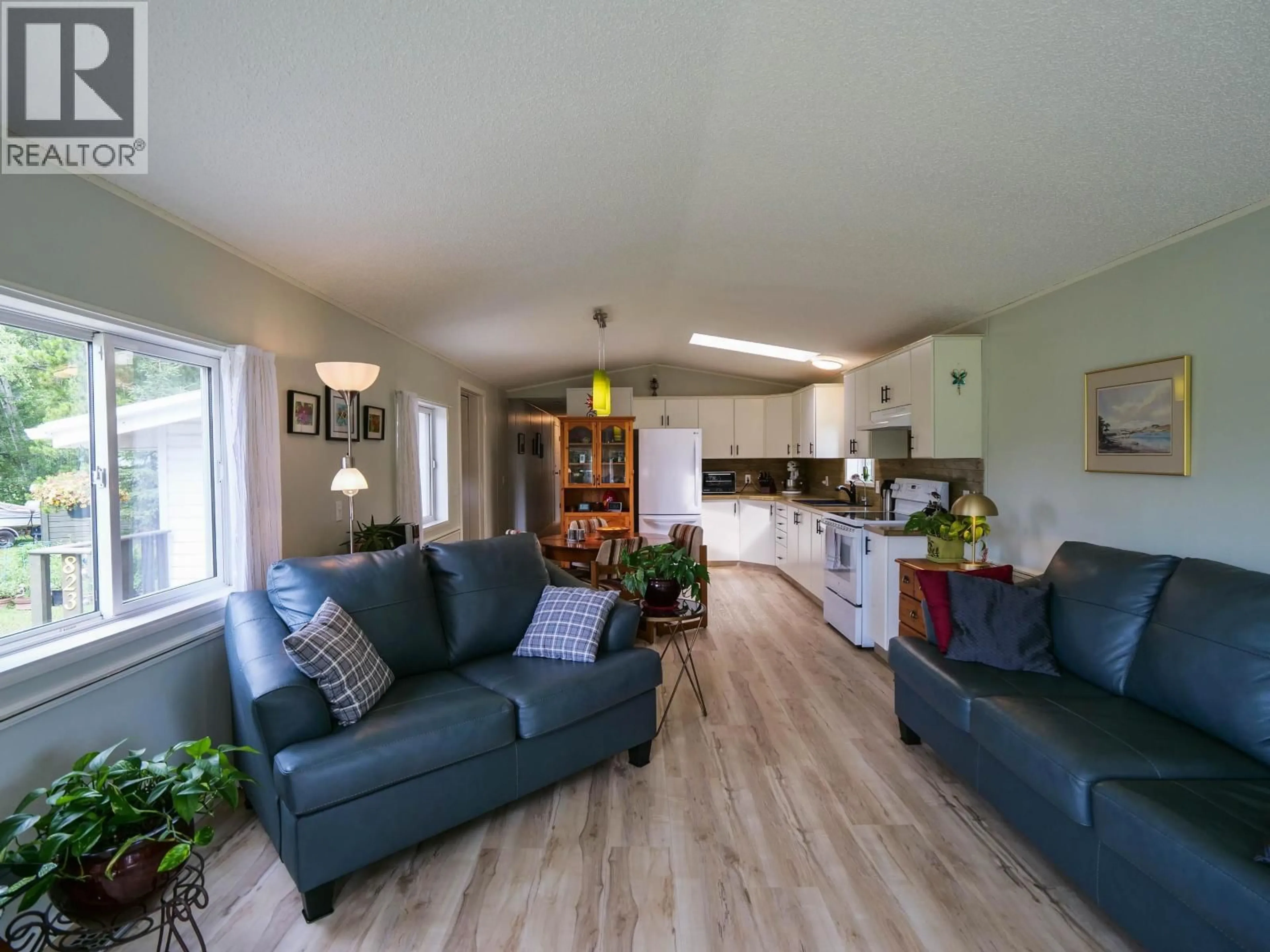 Living room with furniture, wood/laminate floor for 823 BARKERVILLE HIGHWAY, Quesnel British Columbia V2J6S6