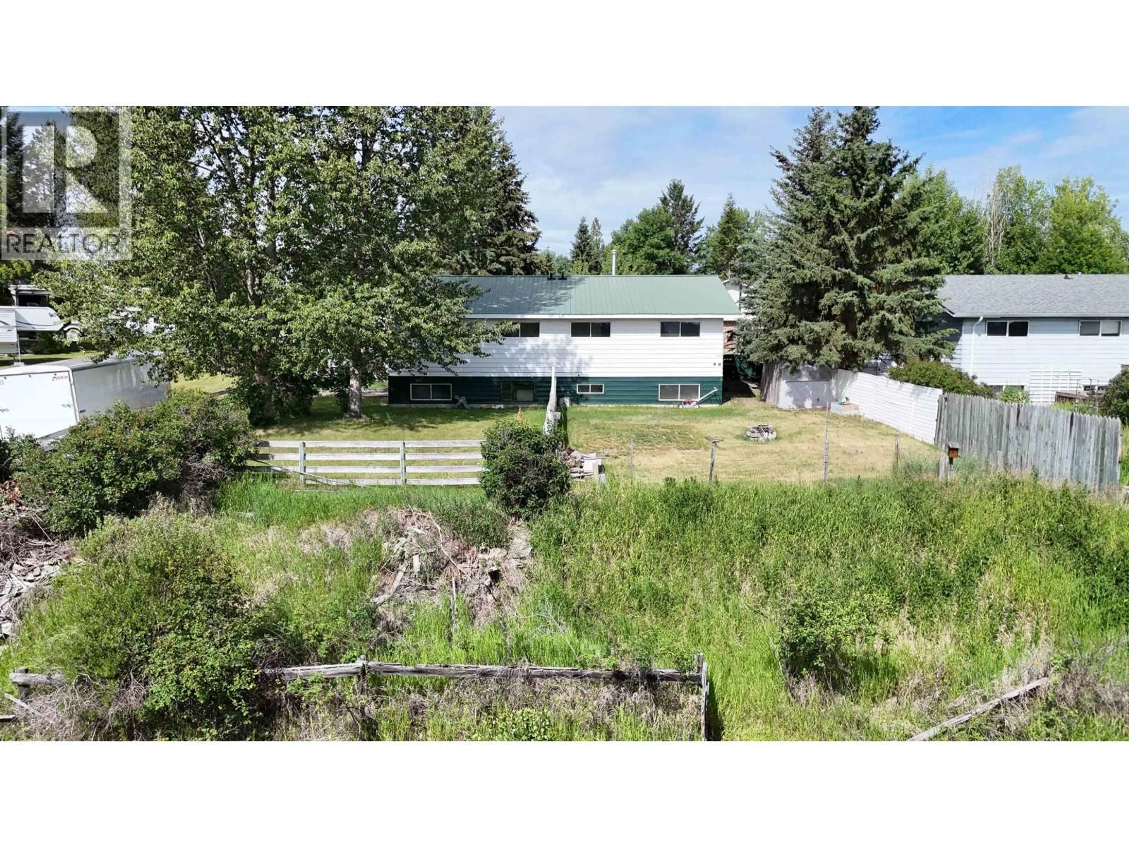 A pic from outside/outdoor area/front of a property/back of a property/a pic from drone, mountain view for 461 EVERGREEN CRESCENT, 100 Mile House British Columbia V0K2E0