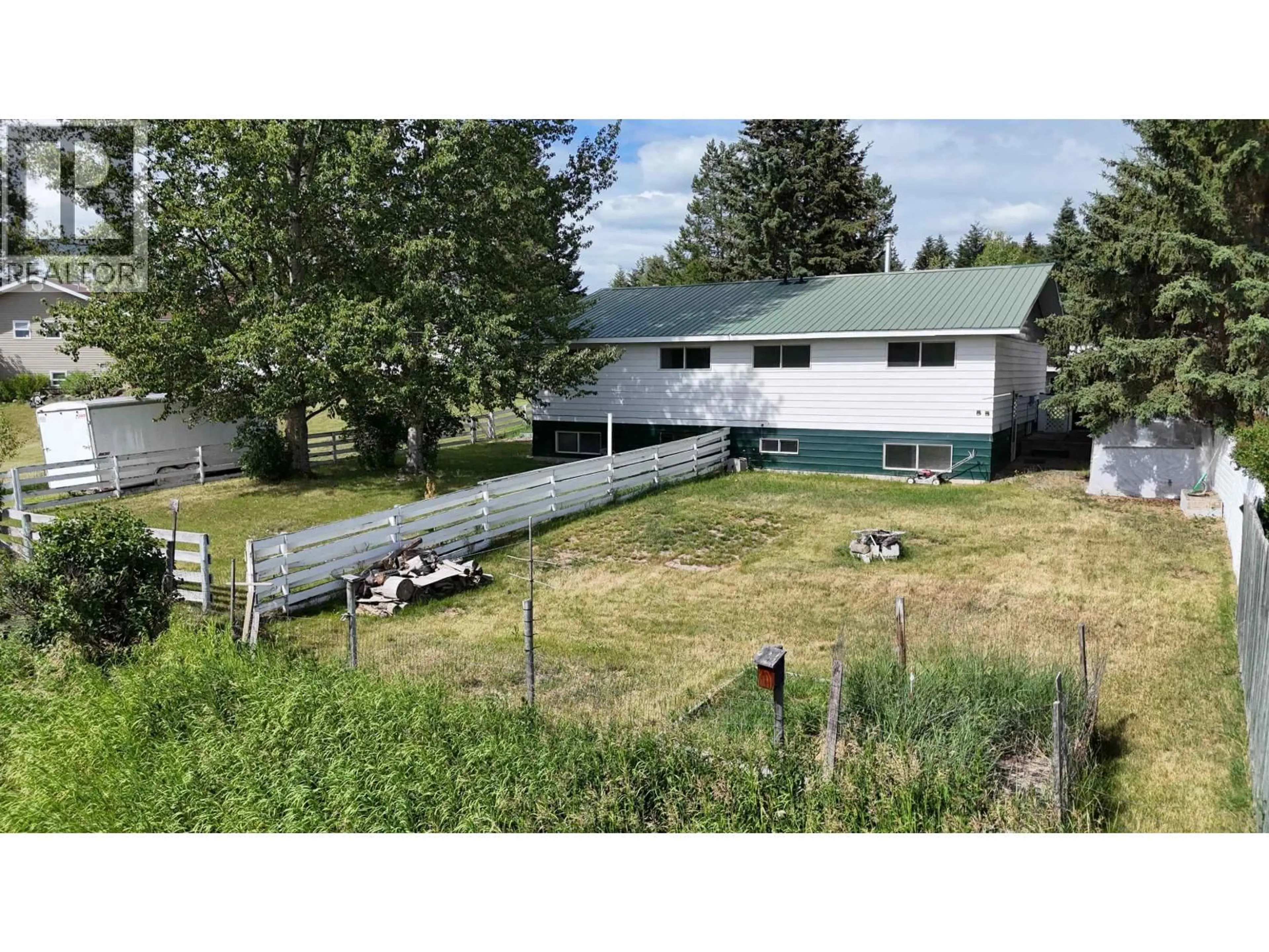A pic from outside/outdoor area/front of a property/back of a property/a pic from drone, unknown for 461 EVERGREEN CRESCENT, 100 Mile House British Columbia V0K2E0